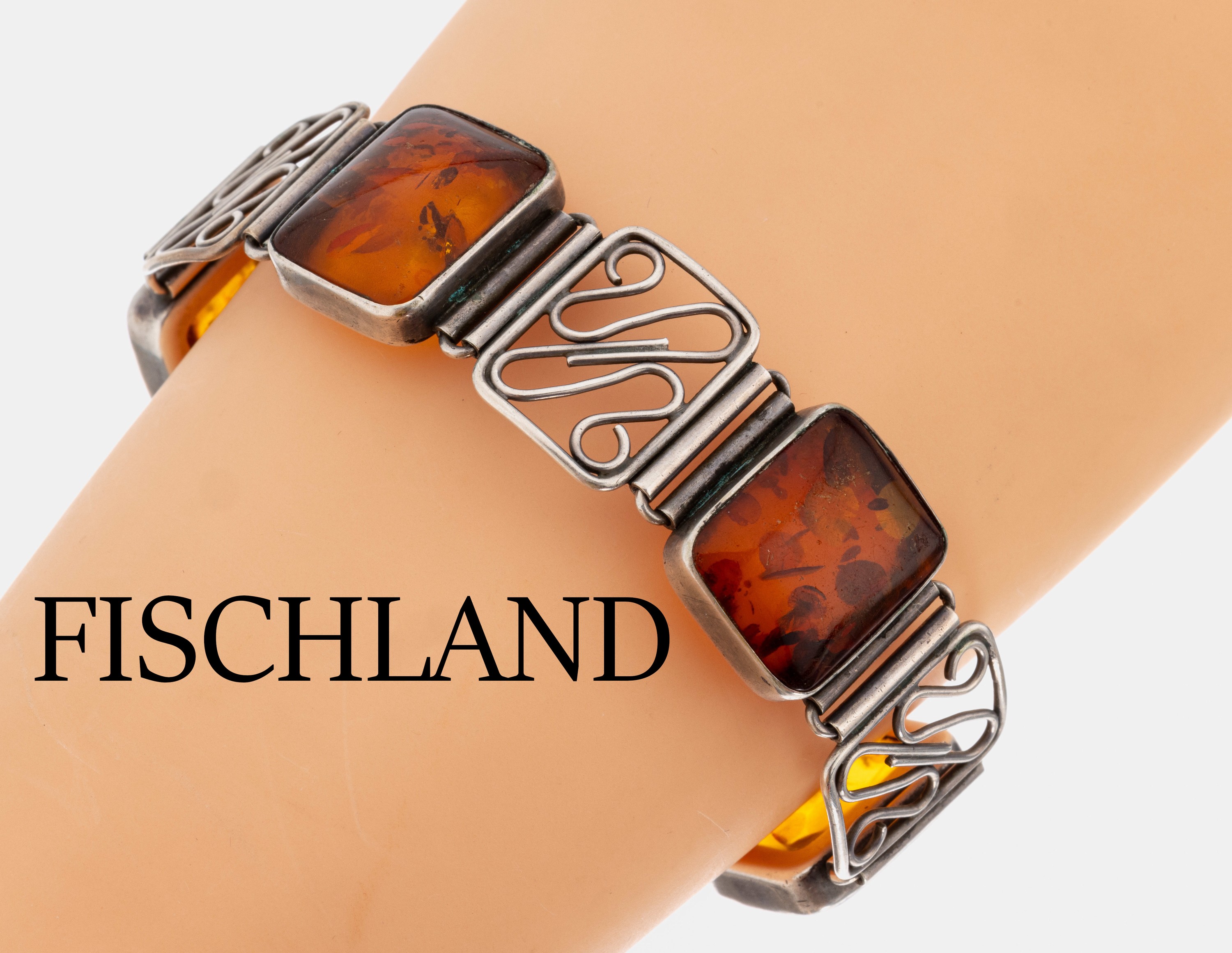 FISCHLAND Bernstein-Armband, 1950er-60er Jahre, 835er Silber, 5 kissenf. Bernstein- Cabochons, Zwischenglieder mit geschwungenen Elementen, L. ca. ...