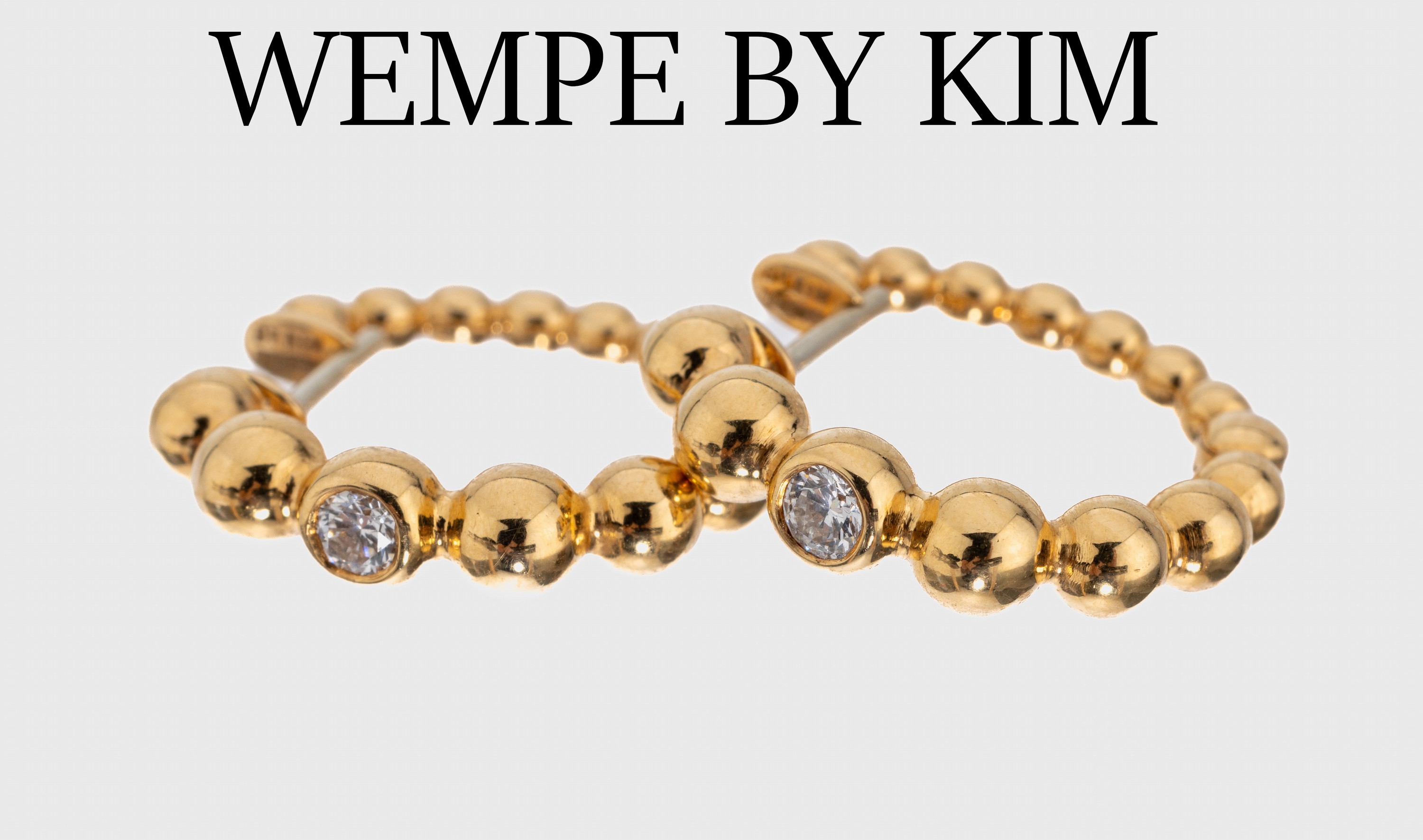 Paar 18 kt Gold WEMPE BY KIM Brillant -Ohrcreolen, GG 750/000, Kugeln im Verlauf,2 Brillanten zus. ca. 0.16 ct Weiß/si, ca. 8.0g, orig. Etui und ...