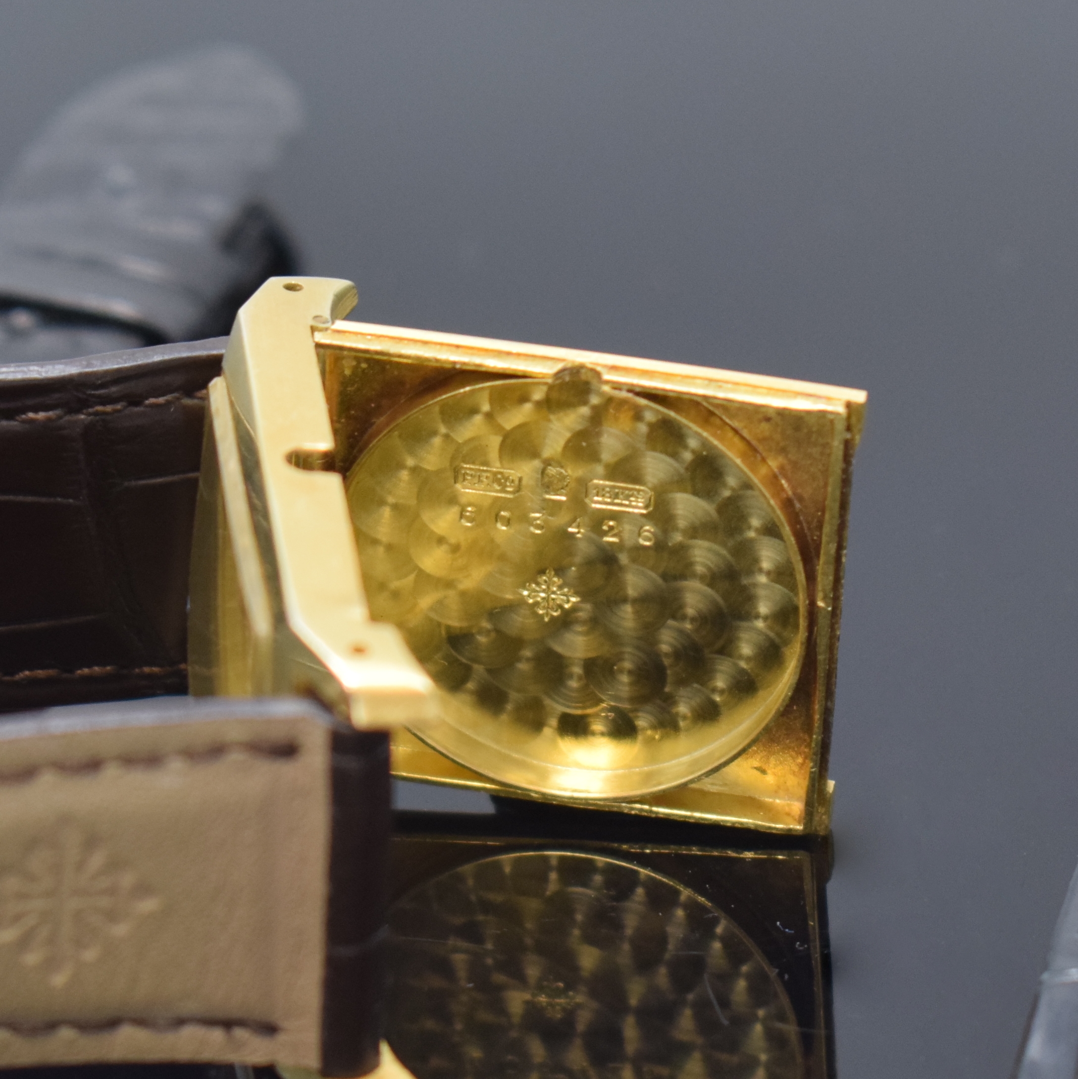 Detail g: PATEK PHILIPPE frühe rechteckige Armbanduhr in GG 750/000, Schweiz um 1920, 2-teil. Scharniergeh. l. dell., PPC Lederband m. PPC Dornschl. in GG ...