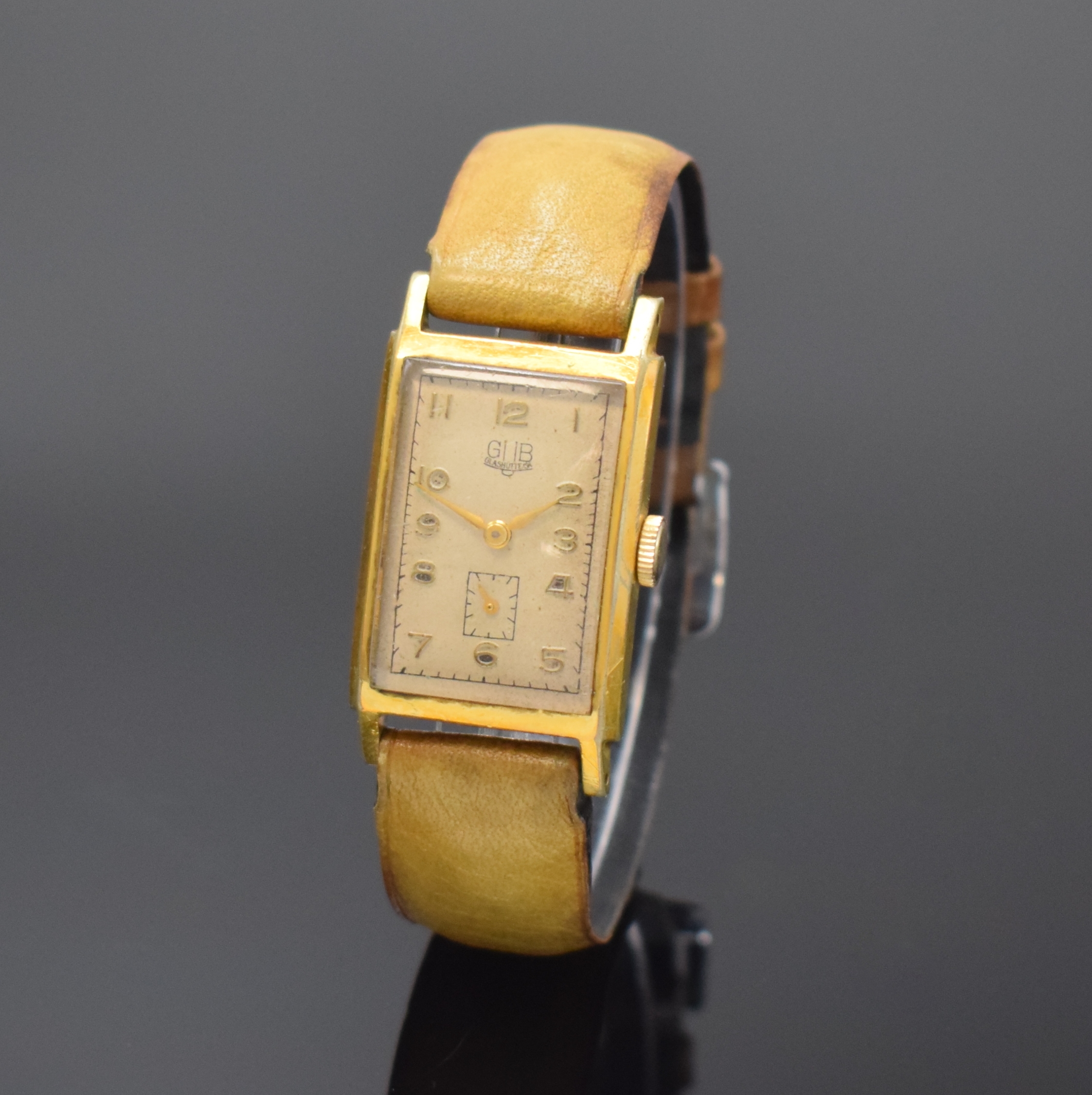 GUB Herrenarmbanduhr Kaliber 62, Deutschland um 1955, Handaufzug, verg. Geh. ber., Edelstahlboden aufgedr., silb. Zifferbl. fl., arab. Zahlen, gold. ...