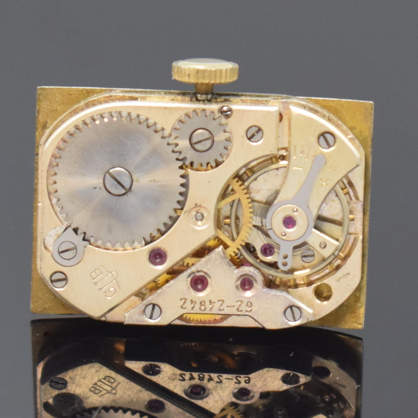 Detail d: GUB Herrenarmbanduhr Kaliber 62, Deutschland um 1955, Handaufzug, verg. Geh. ber., Edelstahlboden aufgedr., silb. Zifferbl. fl., arab. Zahlen, gold. ...