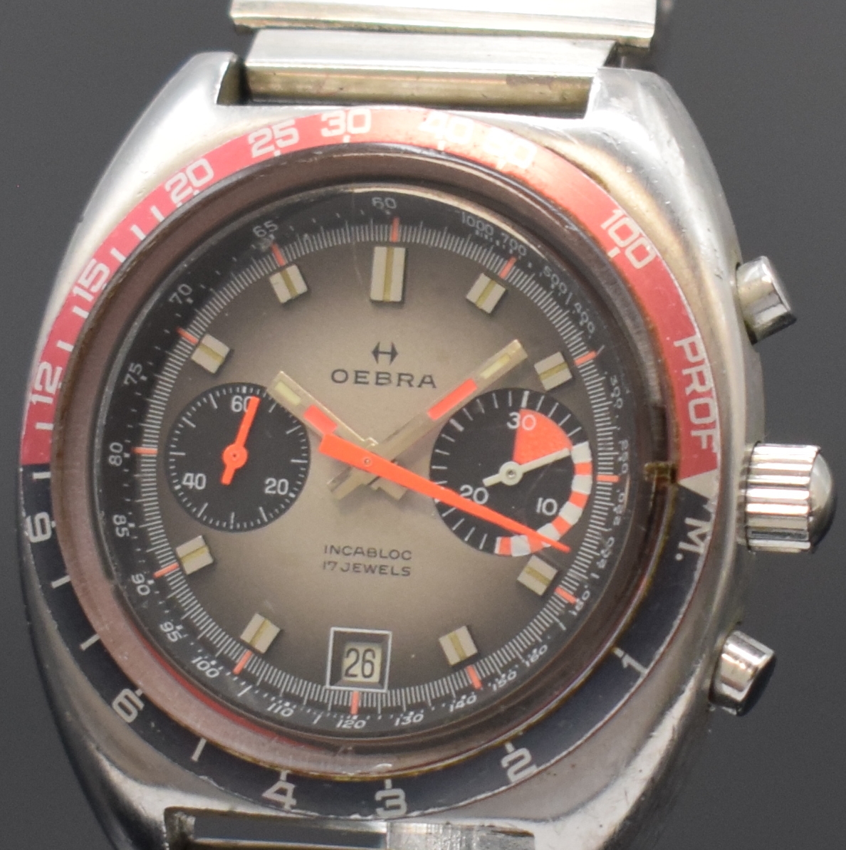 Detail a: OEBRA Herrenchronograph mit Tiefenmesser in Stahl, Schweiz um 1975, Handaufzug, neutr. Stahlband m. Faltschl., Boden u. Krone verschr., Lünette m. ...