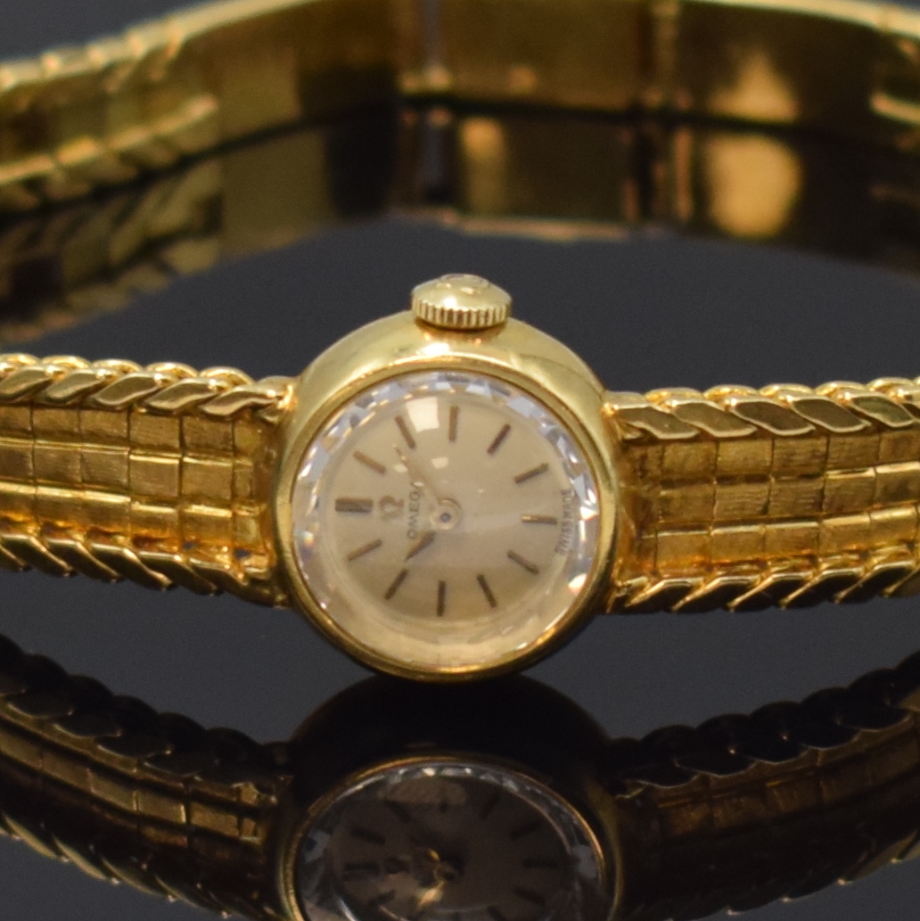 Detail a: OMEGA Damenarmbanduhr in GG 750/000 Referenz 7088 GY, Handaufzug, Schweiz um 1961, 2- teil. Geh., Boden aufgedr., orig. Band zum Ende verlängert, ...