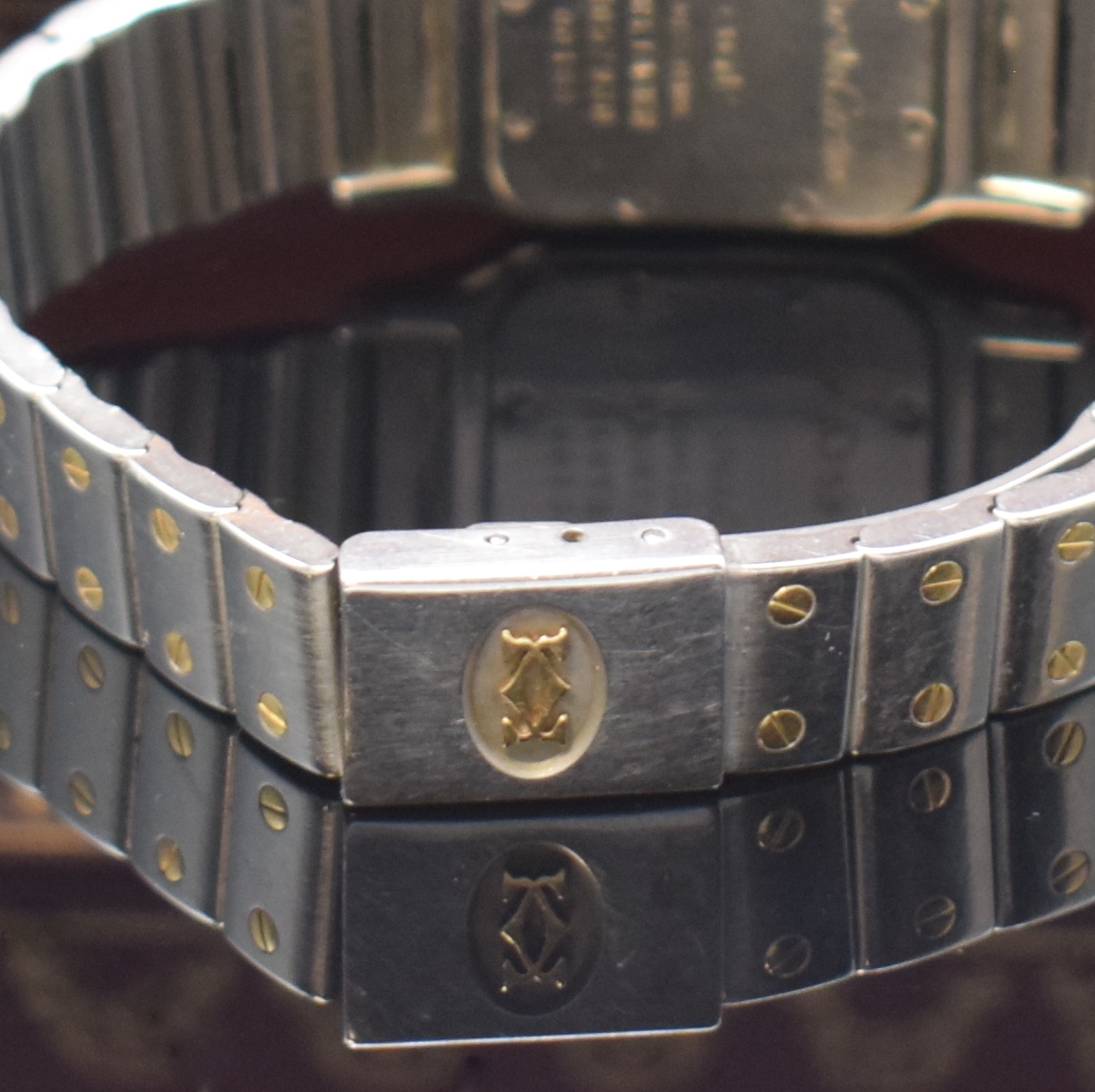 Detail b: CARTIER Santos Damenarmbanduhr in Stahl/Gold Referenz 1057930, Schweiz um 2000, quarz, leicht gebogenes Geh., Boden 8-fach verschr., orig. ...