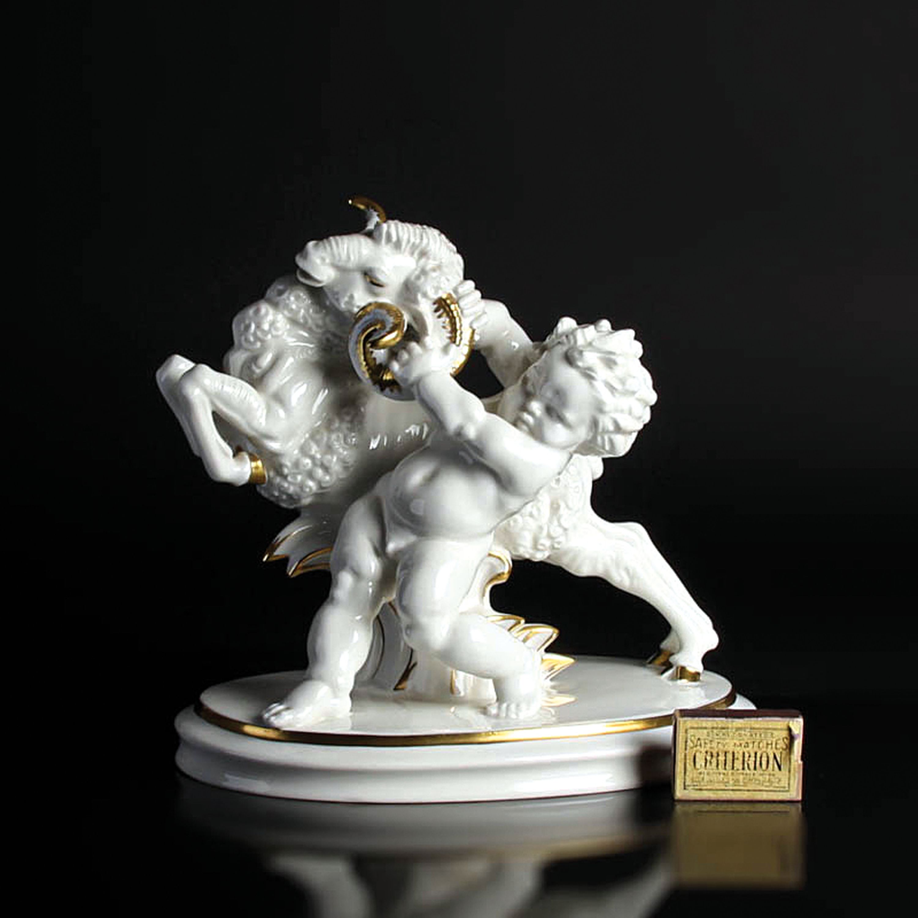 Detail a: Porzellanfigur, "Übermut", Hutschenreuther, Entwurf Karl Tutter um 1929-38, Darstellung eines Puttos, einen aufbäumenden Widder bei den ...