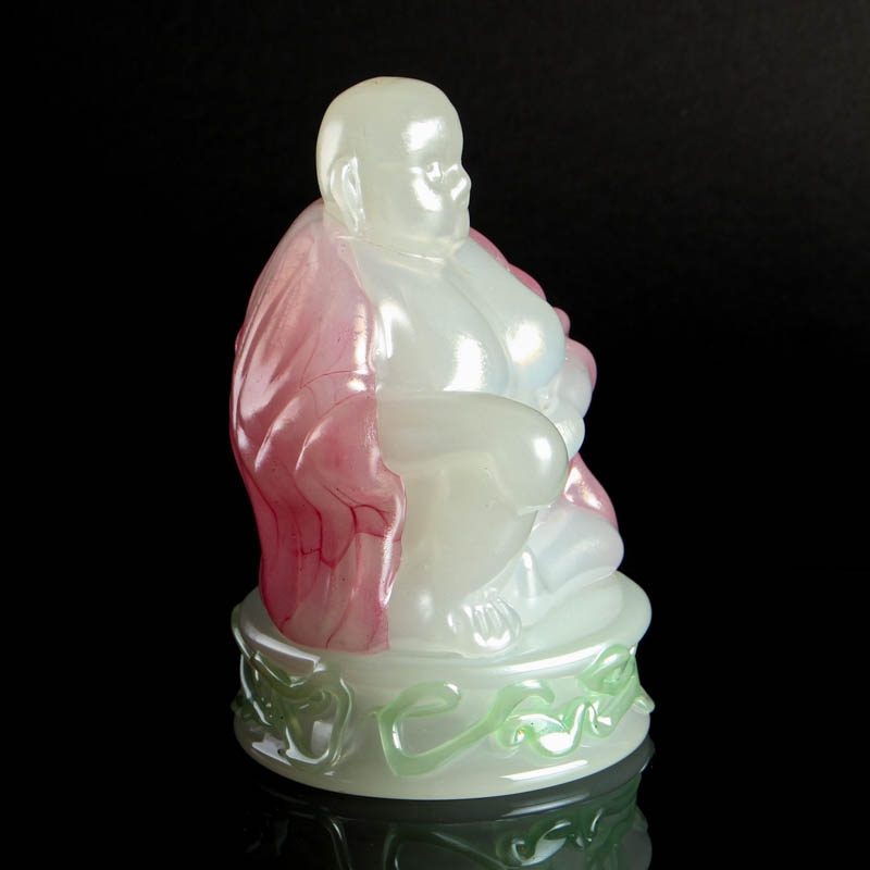Detail a: Glasskulptur Buddha, Murano, Italien, 2.Hälfte20.Jh., opak weißes Glas, grüne und rosafarbene Aufschmelzungen, sitzender Buddha auf Sockel, ...