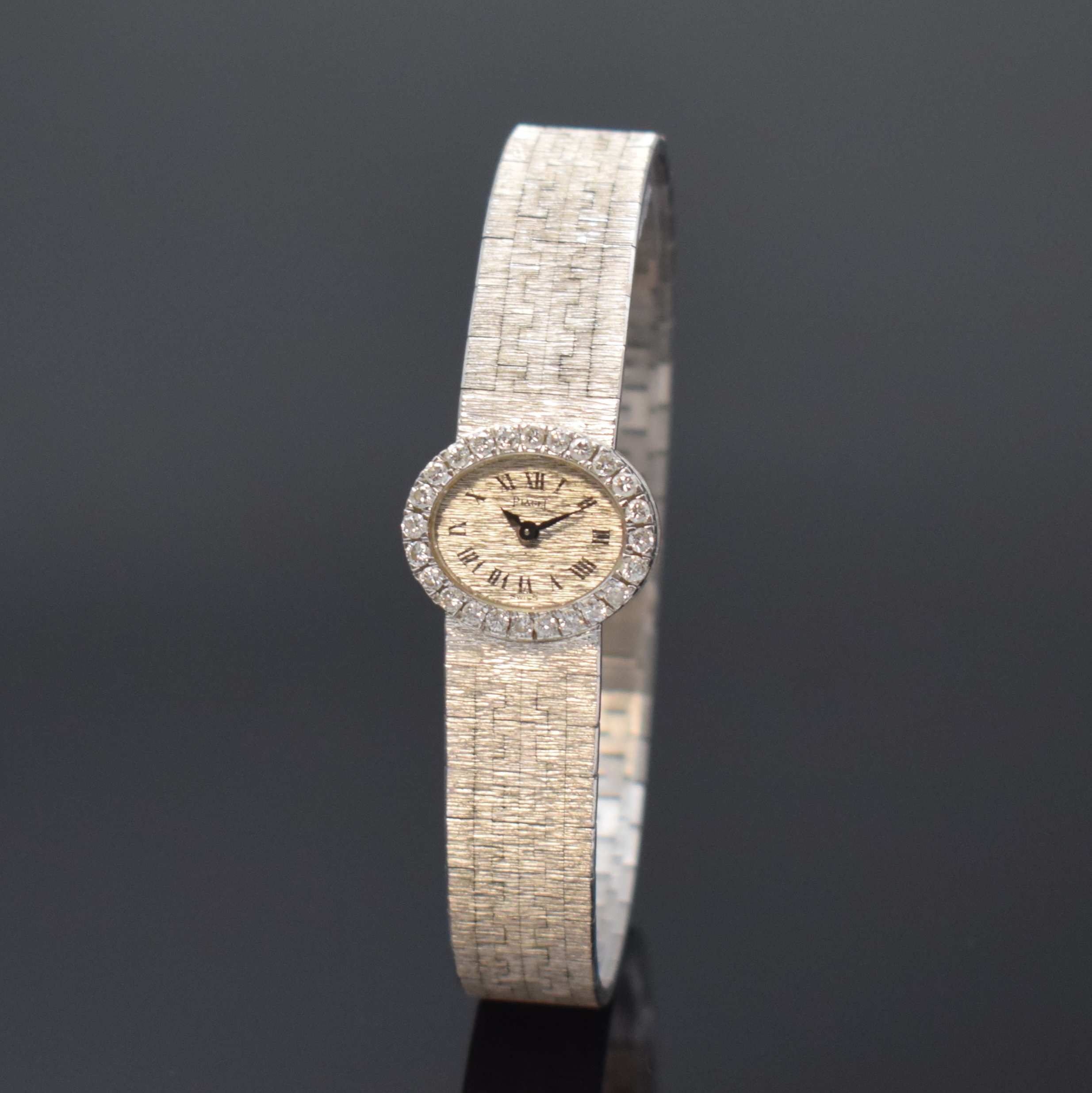 PIAGET Backwinder Damenarmbanduhr in WG 750/000 mit Diamanten Referenz 3766 A 6, Schweiz um 1960, Handaufzug, orig. Goldband, Lünette aufw. m. ...
