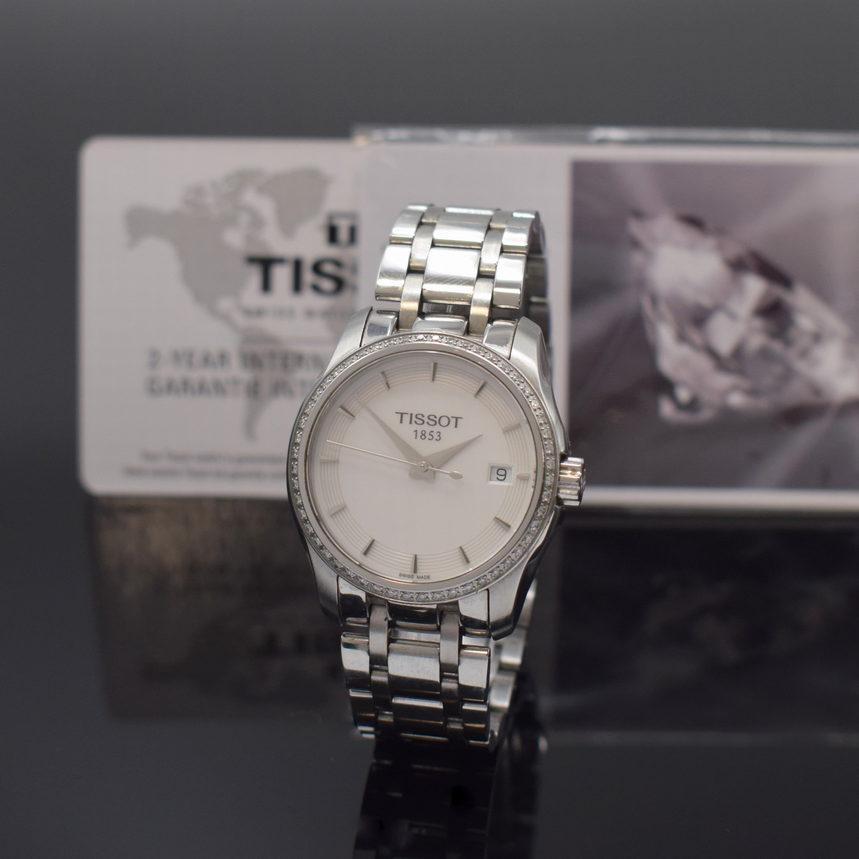 TISSOT Damenarmbanduhr Couturier in Stahl mit Brillantlünette Referenz T035210, Schweiz verk. lt. beil. Garantie 06/2015, quarz, orig. Gliederband ...