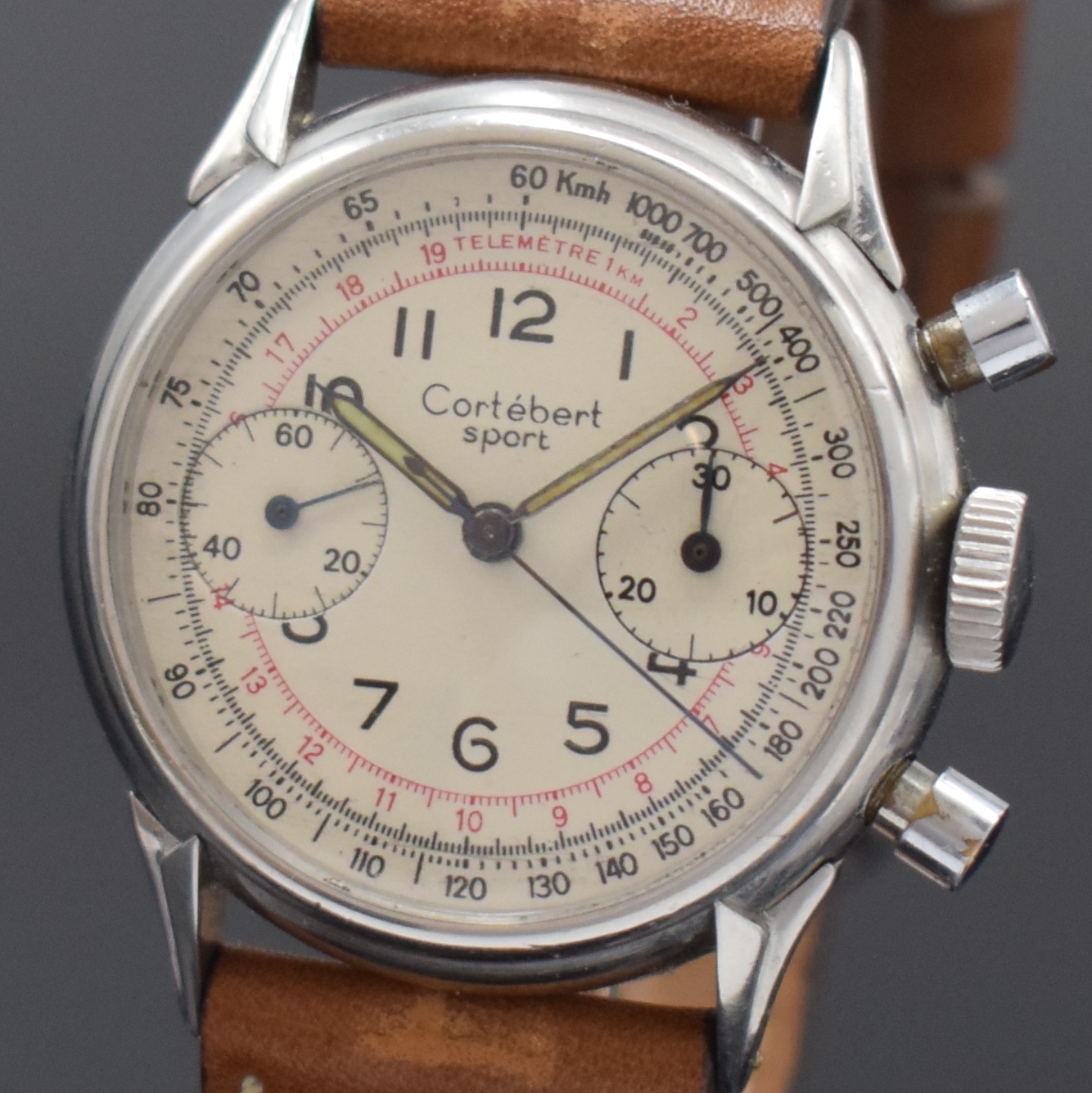Detail a: CORTEBERT verschraubter Schaltradchronograph in Stahl, Schweiz um 1950, Handaufzug, 2- tlg. Geh., ausgefallene Bandanstöße, silb. Zifferbl. rest., ...