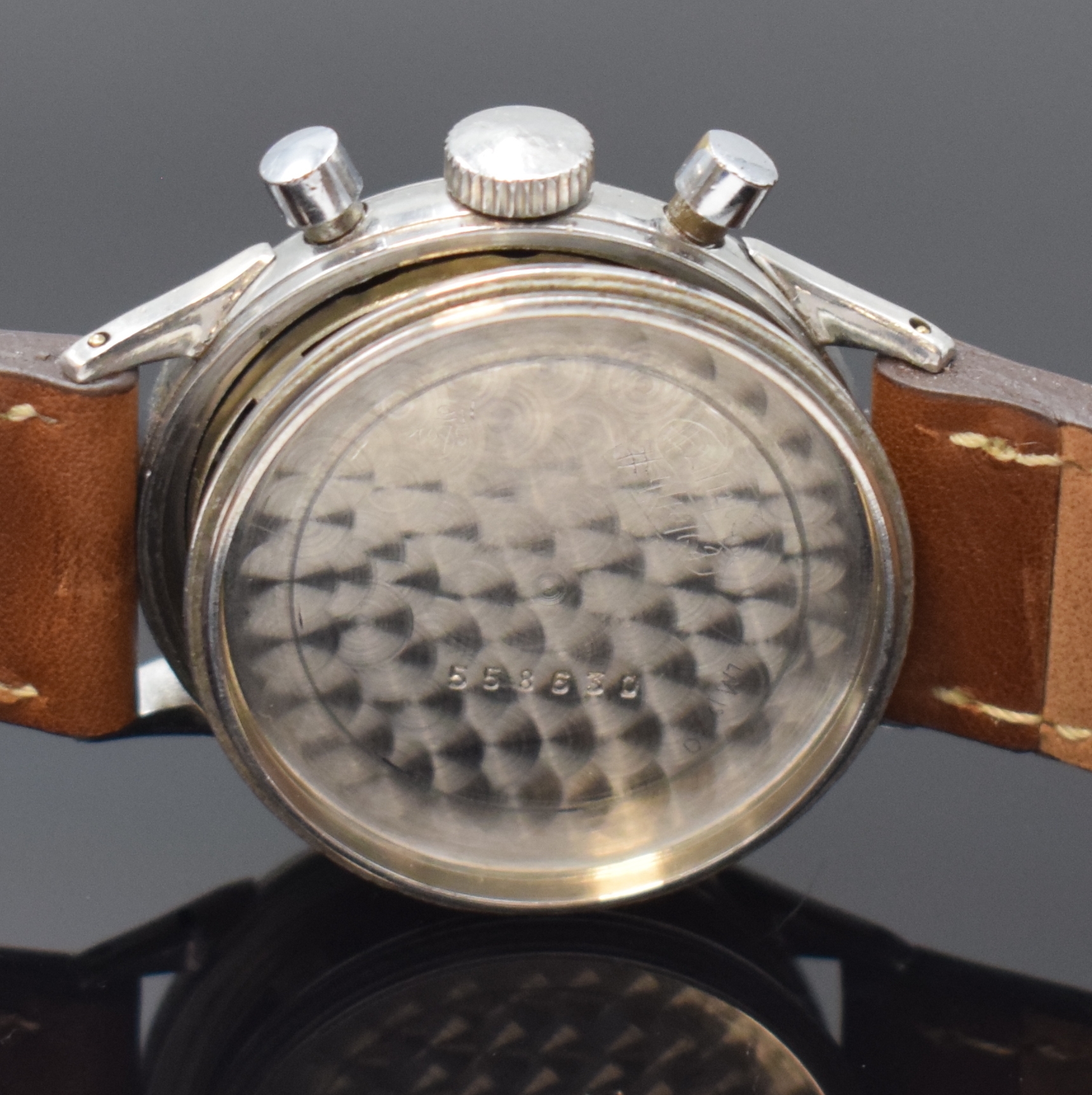 Detail e: CORTEBERT verschraubter Schaltradchronograph in Stahl, Schweiz um 1950, Handaufzug, 2- tlg. Geh., ausgefallene Bandanstöße, silb. Zifferbl. rest., ...