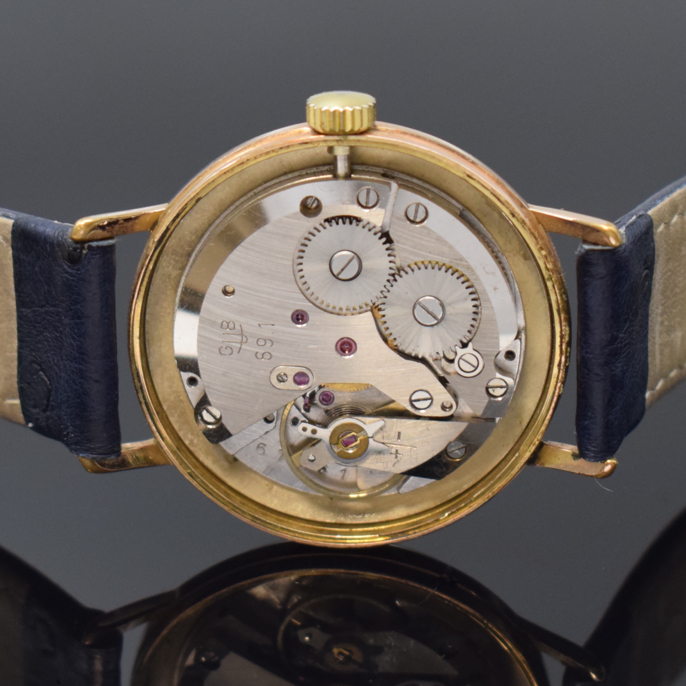 Detail d: GLASHÜTTE Kaliber 69.1 vergoldete Armbanduhr, DDR um 1965, Handaufzug, 2-tlg. Geh., Stahlboden aufgedr., silb. Zifferbl. pat., gold. Indizes u. ...