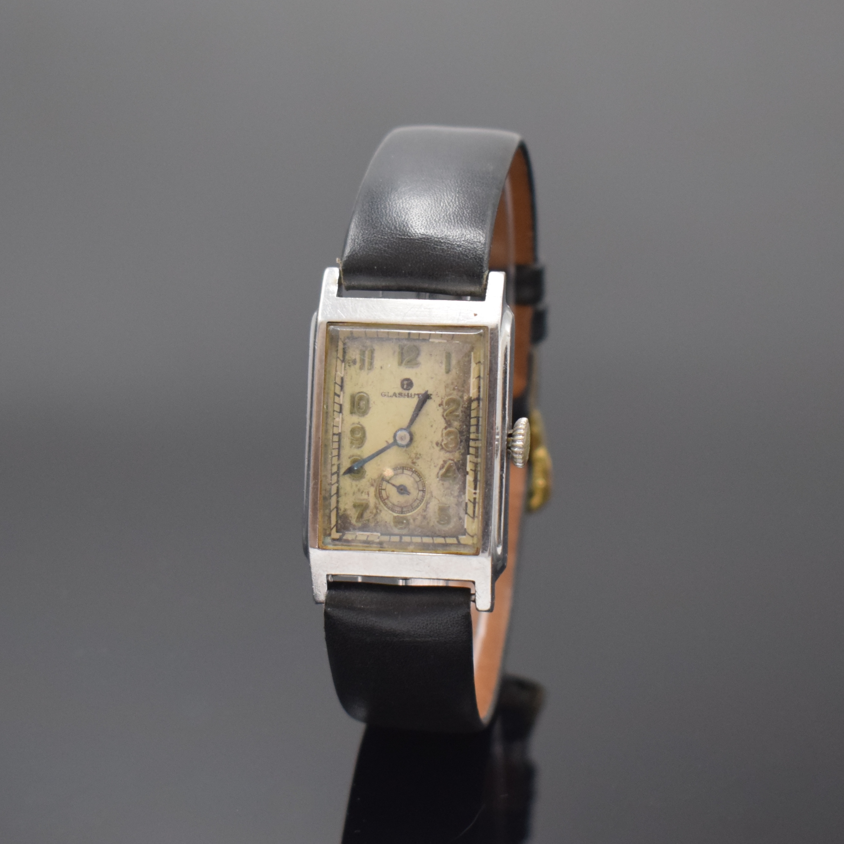 TUTIMA GLASHÜTTE Armbanduhr mit Kaliber Urofa 58 in Stahl, Deutschland um 1935, Handaufzug, rechteckig. Geh., Scharnierboden, silb. Zifferbl. ...