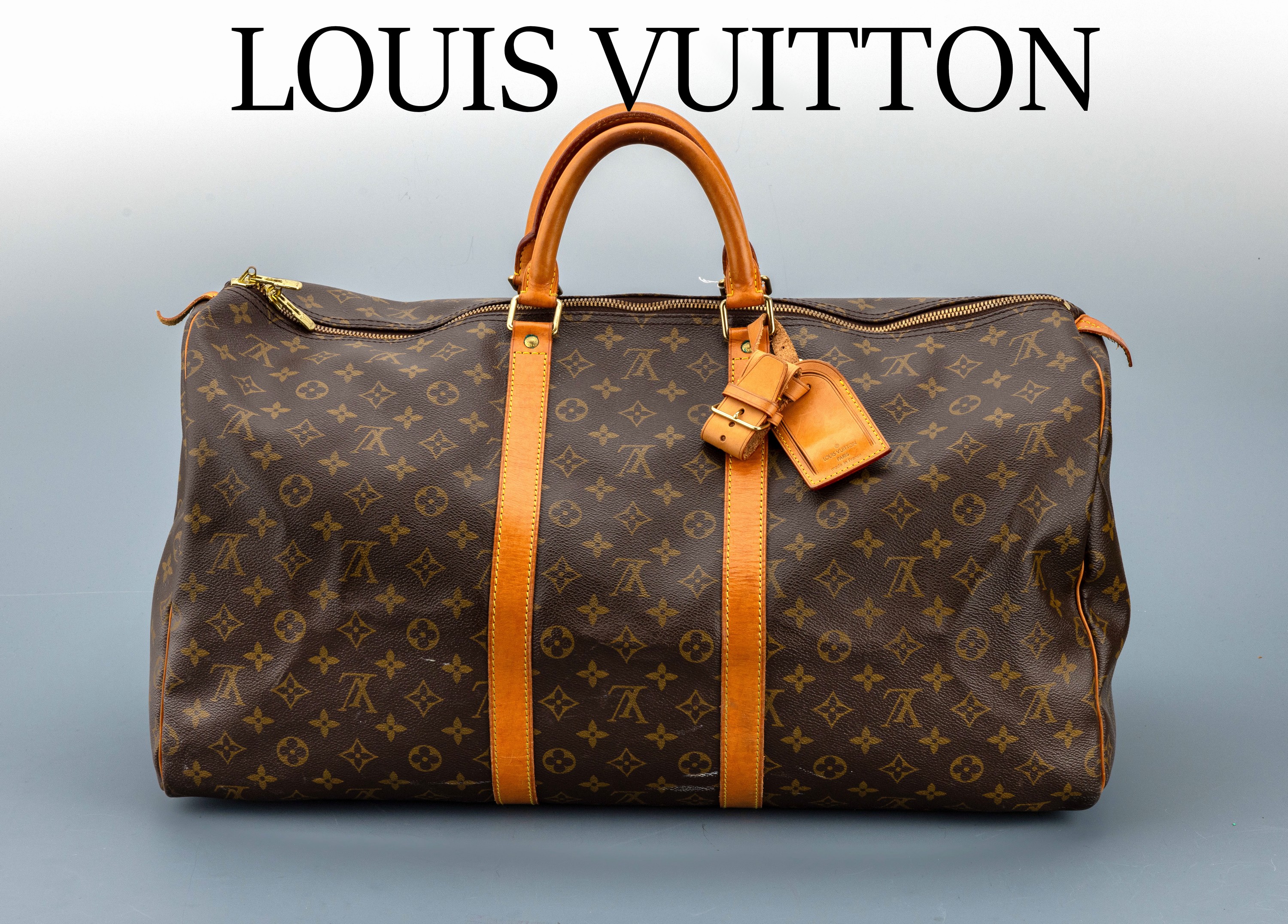 LOUIS VUITTON Keepall 55, Monogram Canvas, Besätze, Adressanhänger und Tragehenkel naturfarb. Leder, innen brauner Leinenstoff, ca. 55 x 40 cm