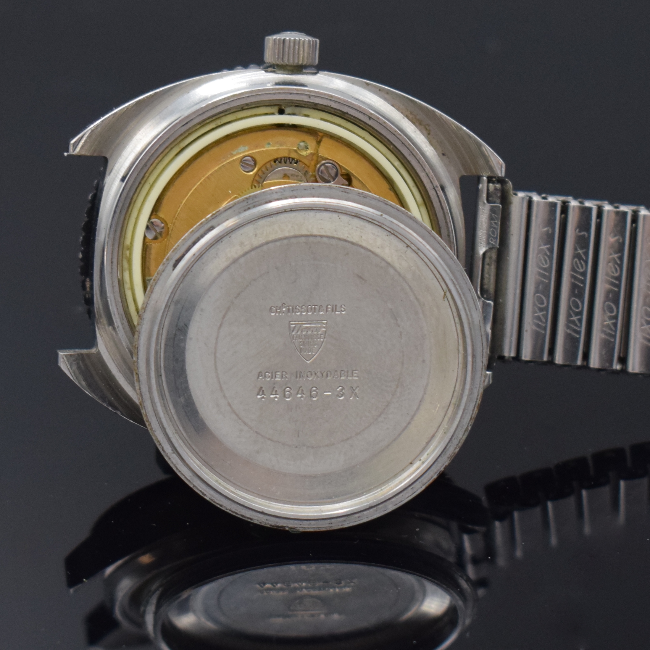 Detail d: TISSOT Navigator Herrenarmbanduhr in Stahl, Schweiz um 1970, Automatik, Boden geschr., neutr. Flexband, Lünette m. 60er Teilung eins. drehb., ...