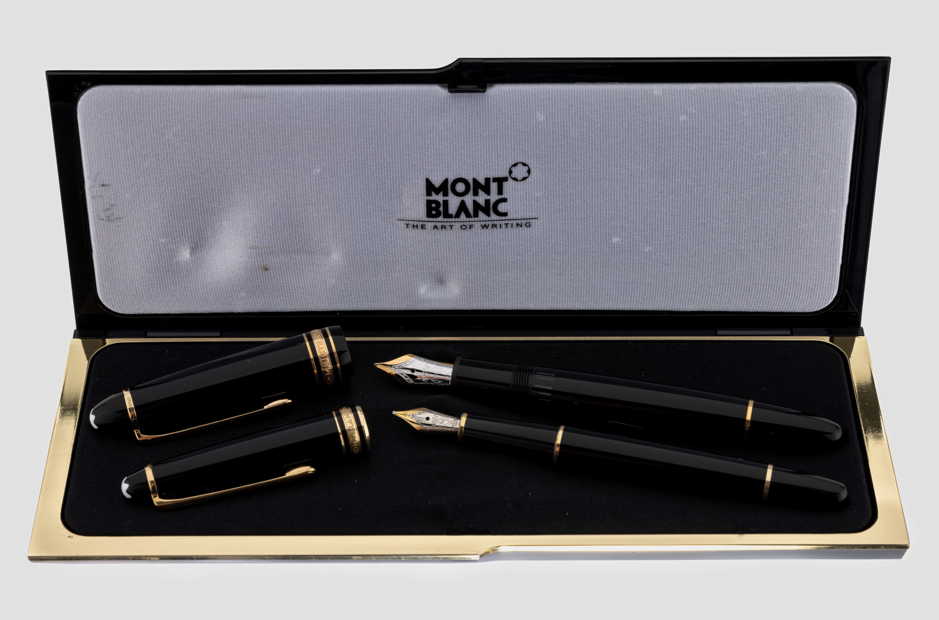 Konvolut 2 MONTBLANC Füllfederhalter, Meisterstück, Korpus schwarzer Hartlack, Federn GG/WG 585/000, Stärke M, in orig. Etui mit Umkarton und ...