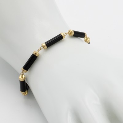 26888987a - Armband mit Onyxen, GG 585/000, Onyxwalzen m. Goldendkappen, Karabinerschl., L. ca. 19 ...