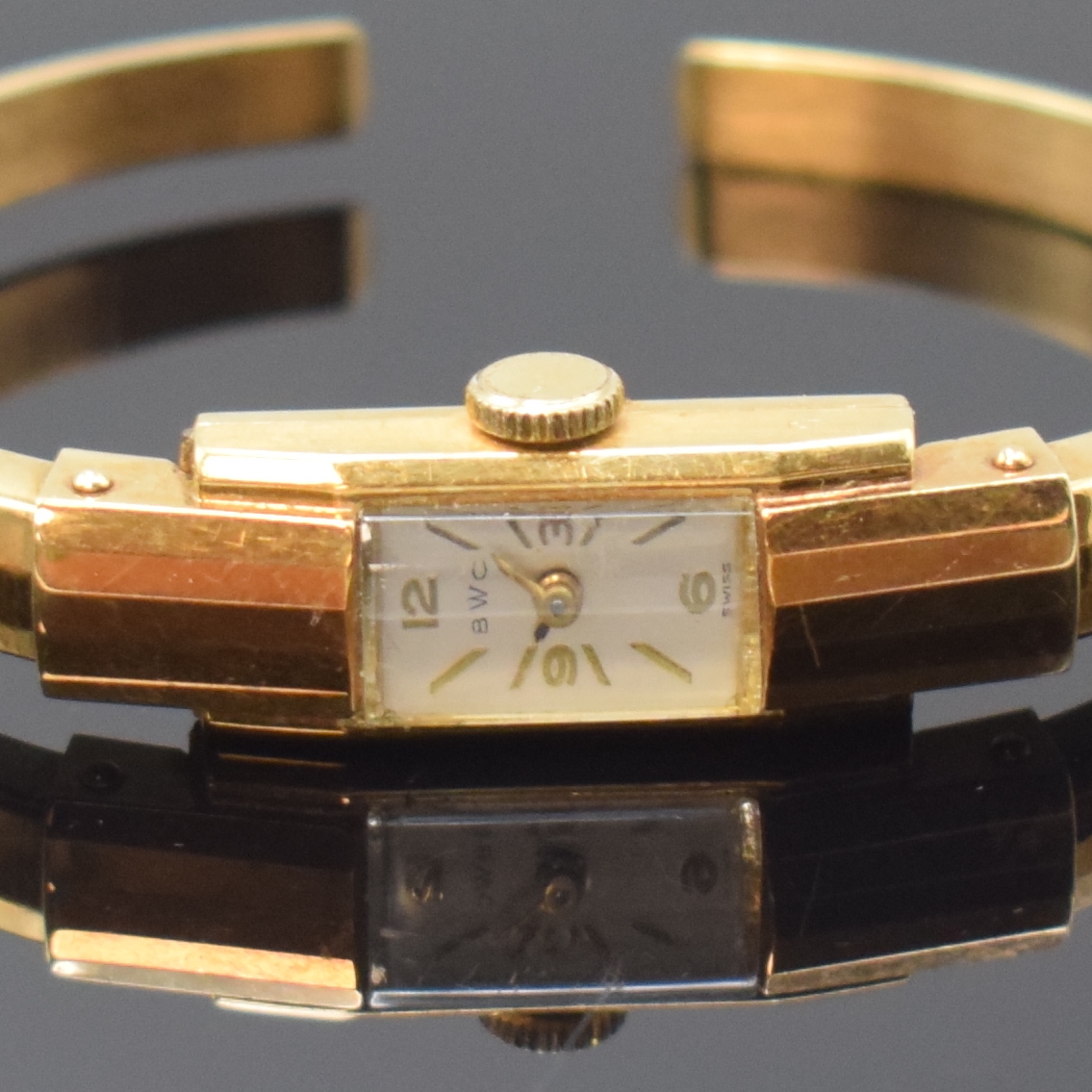 Detail a: BWC Spangenuhr in GG 585/000, Schweiz um 1940, Handaufzug, Scharnierboden, silb. Zifferbl., gold. Std.-Ind. u. Zahlen, gold. Zeiger, geschw. Std.- ...