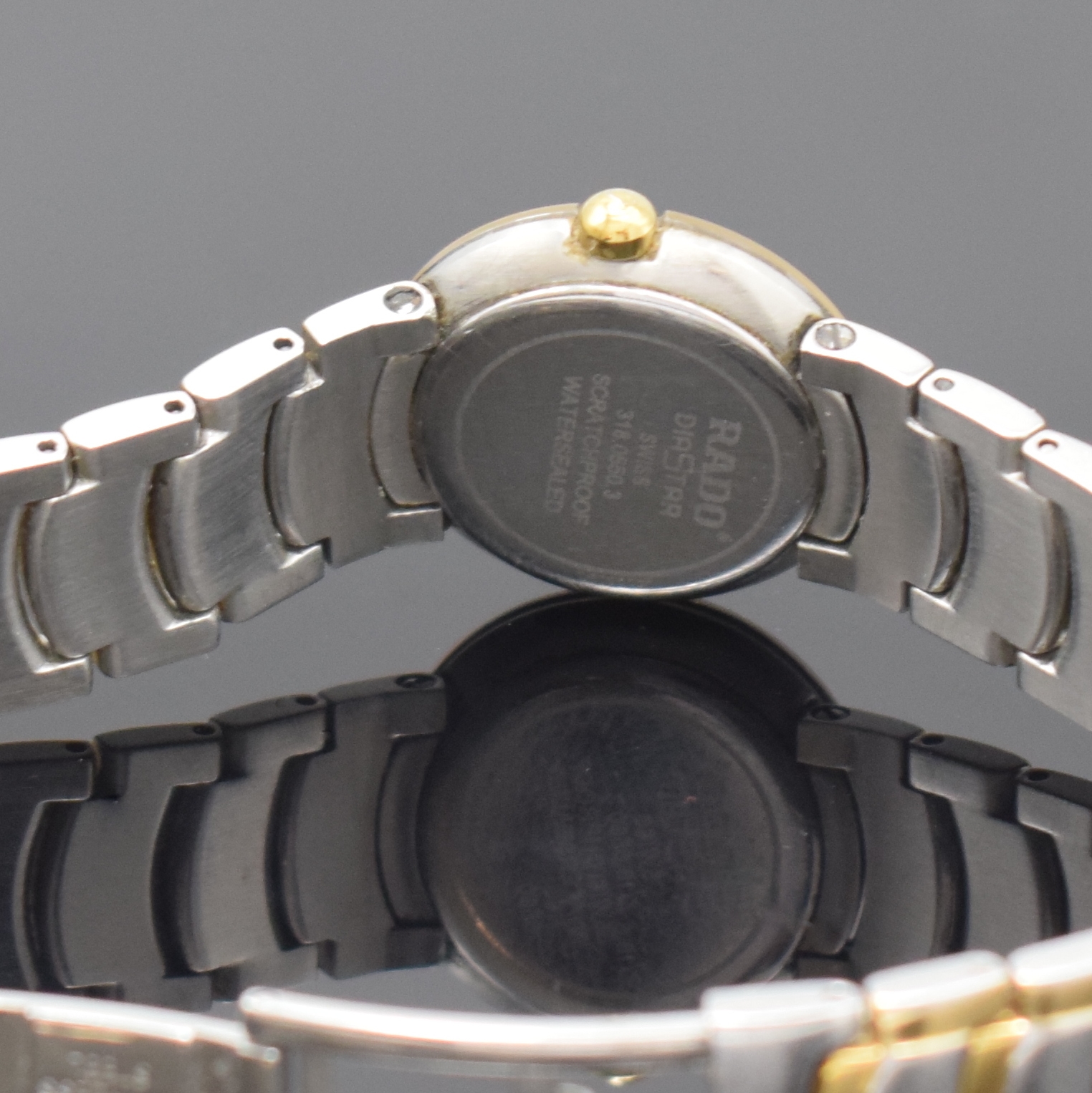 Detail e: RADO Diastar Damenarmbanduhr Referenz 318.0550.3, Schweiz um 1995, quarz, Gliederband m. dopp. Faltschl., Boden aufgedr., silb. Zifferbl. m. gold. ...