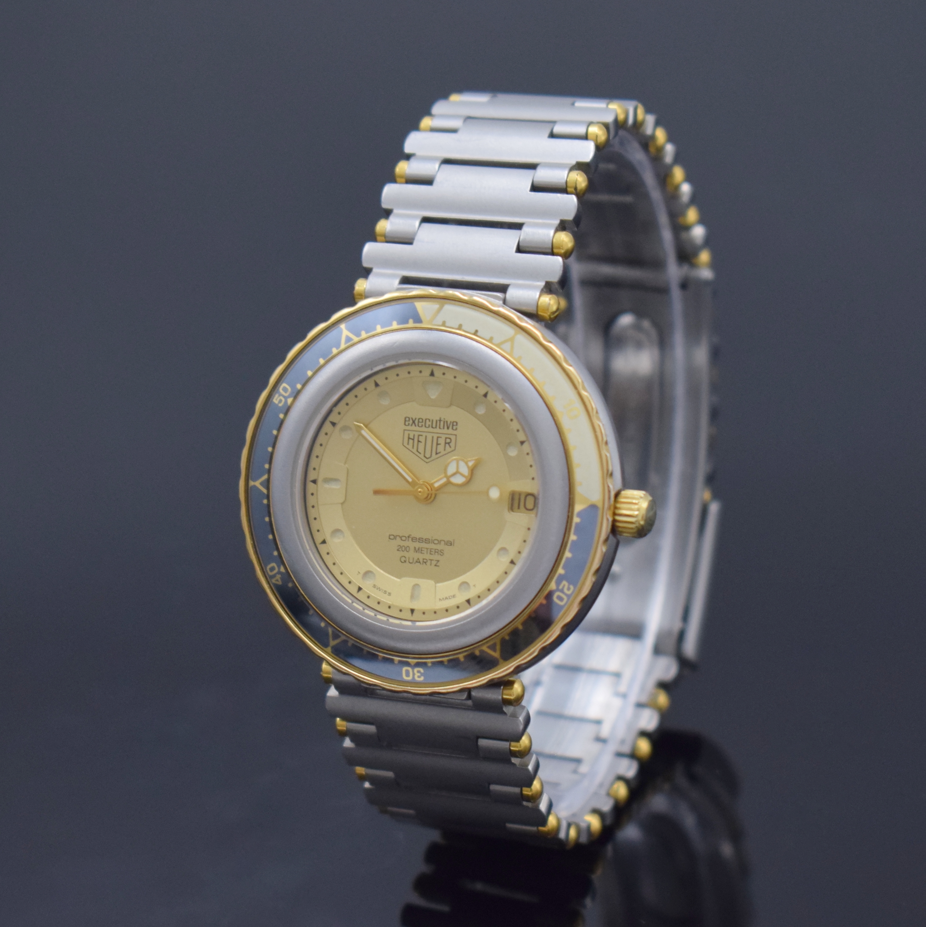HEUER professional Executive Armbanduhr Referenz 915.413, Schweiz um 1985, quarz, Edelstahlgeh. inkl. orig. Gliederband m. Faltschl., Boden u. Krone ...