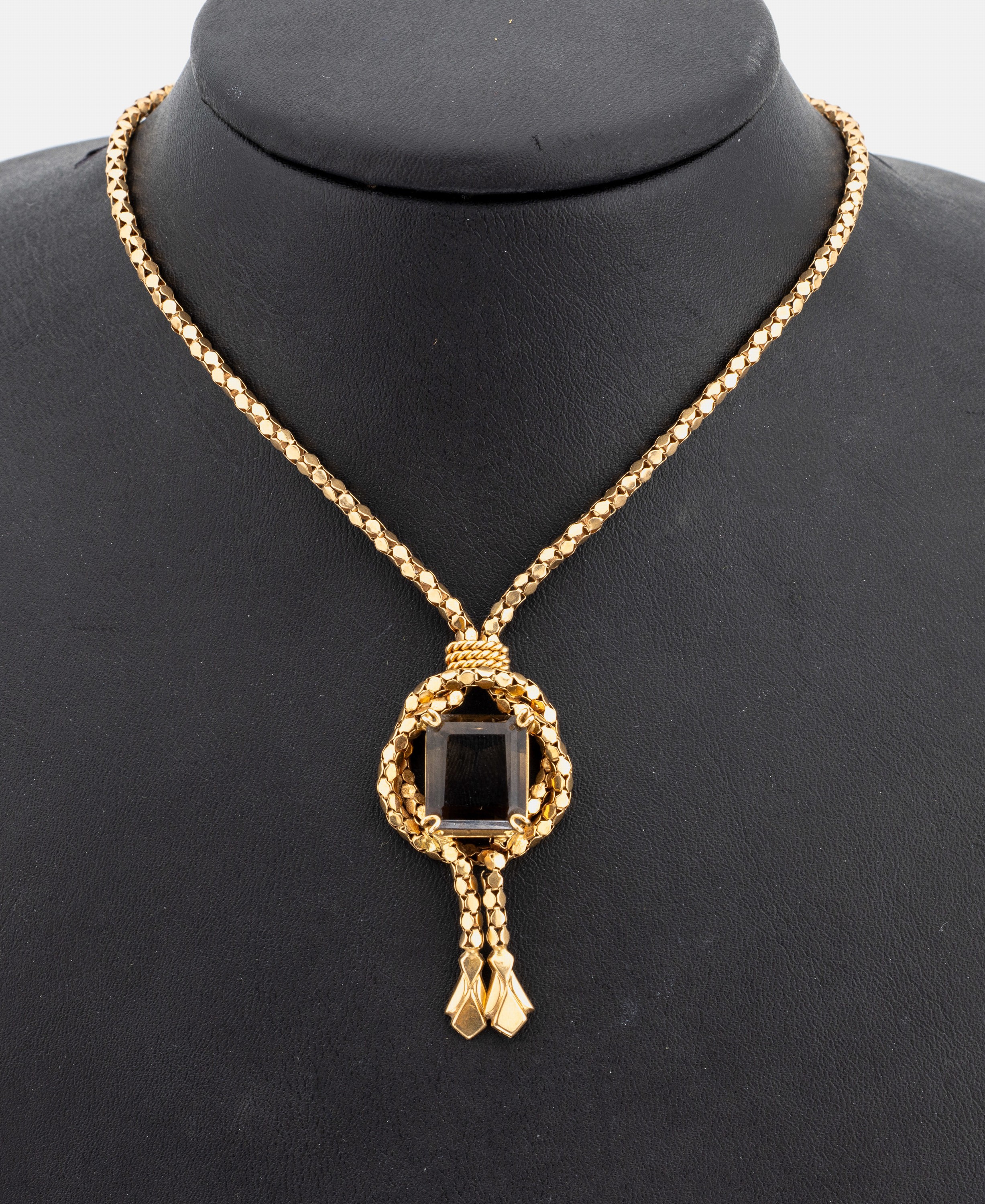 18 kt Gold Rauchquarz-Collier, GG 750/000, aufwändig aus kl. Goldplättchen, geschwungenesMittelteil mit facett. Rauchquarz, L. ca. 47 cm, ...