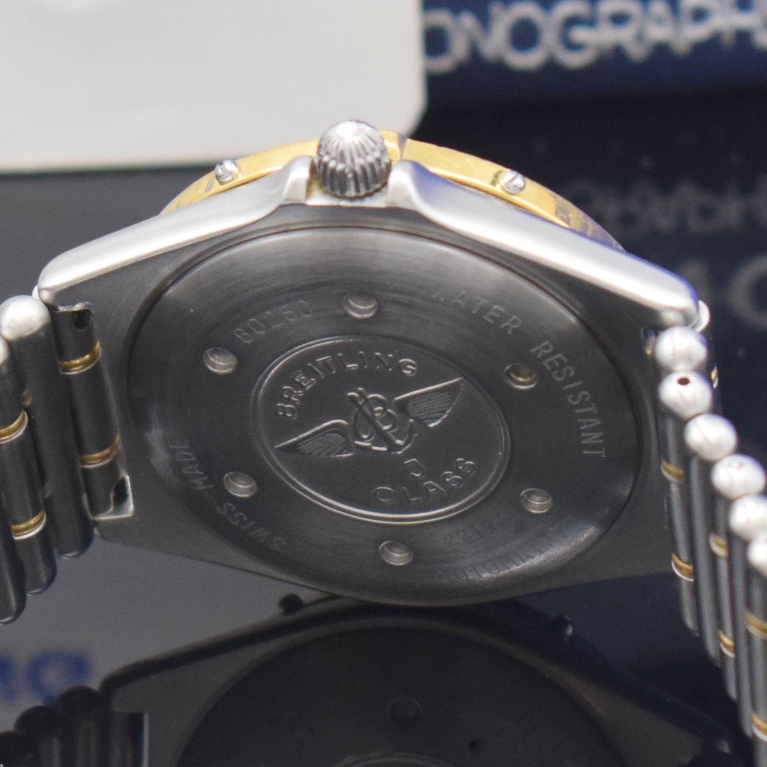 Detail e: BREITLING J-Class Herrenarmbanduhr Referenz 80250, Automatik, verschr. Edelstahlgeh. inkl. orig. Roleauxband m. dopp. Faltschl., Gold-Lünette m. ...
