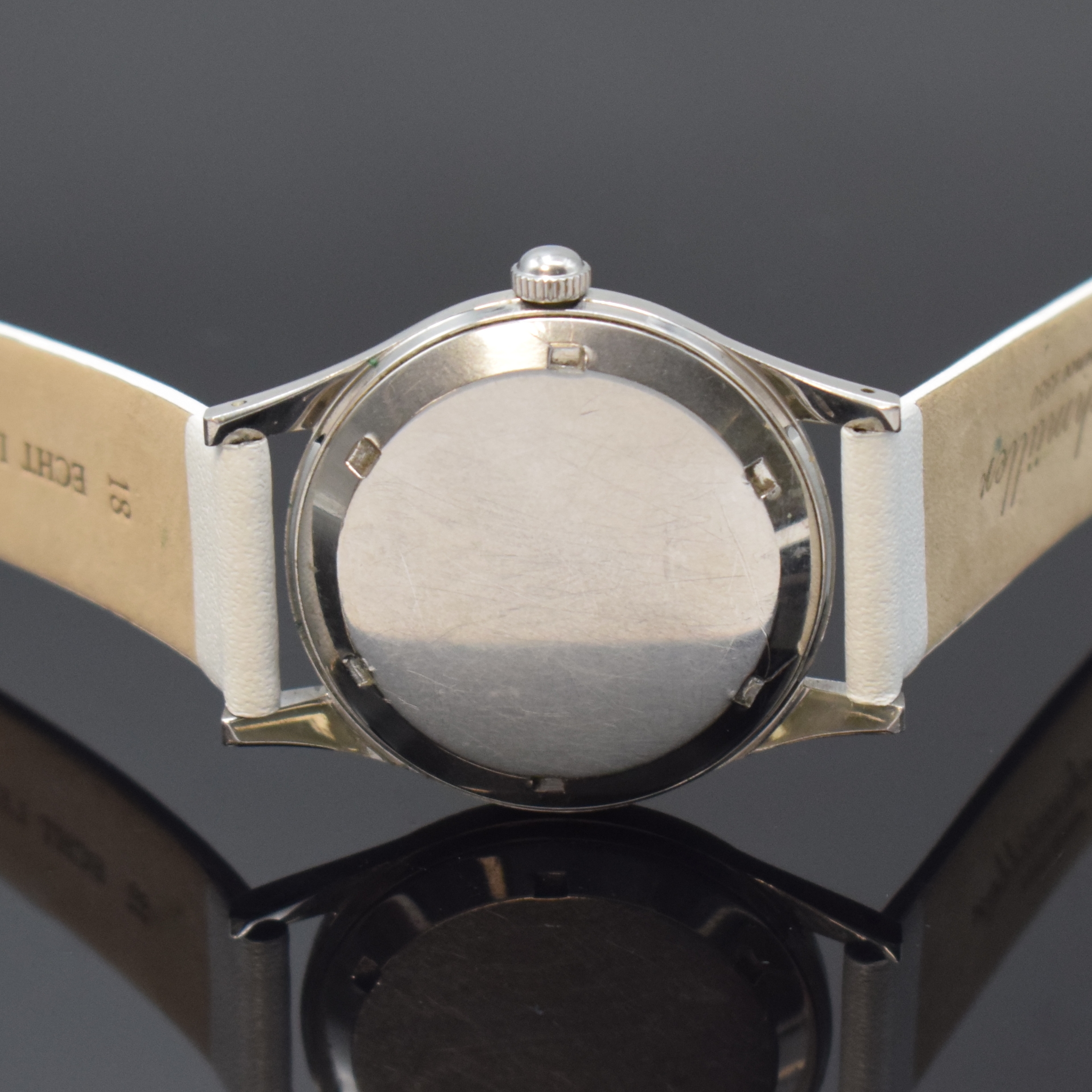 Detail c: ETERNA Herrenarmbanduhr in Stahl, Schweiz um 1945, Handaufzug, verschr. Geh., silb. Zifferbl., gold. Indizes u. Zeiger, Zentralsek., vern. Werk Kal. ...