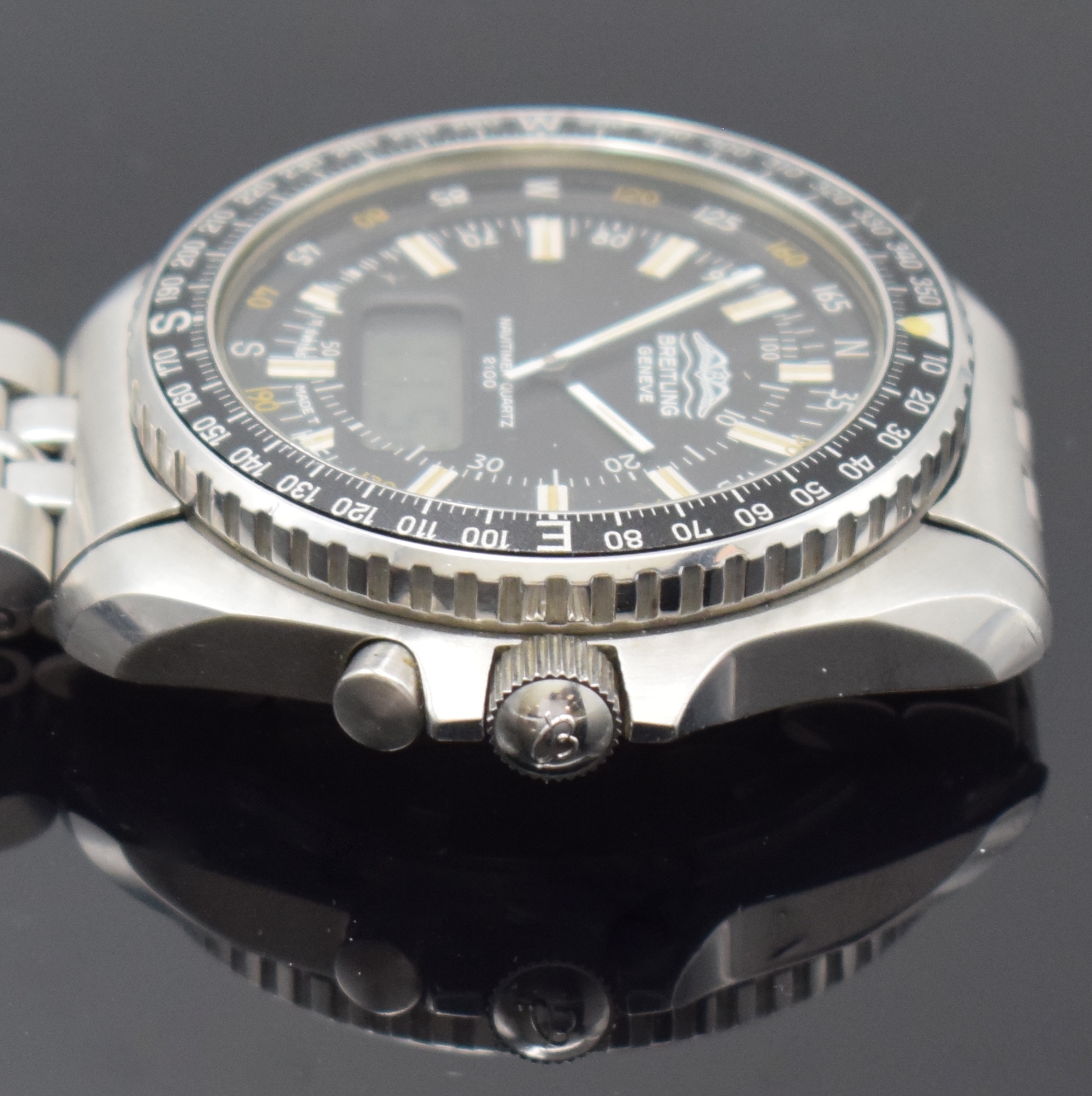 Detail c: BREITLING Navitimer Quartz 2100 Pluton Multifunktionsuhr in Stahl Referenz 80190, Schweiz um 1980, verschr. Geh. inkl. orig. Stahlband m. Faltschl., ...
