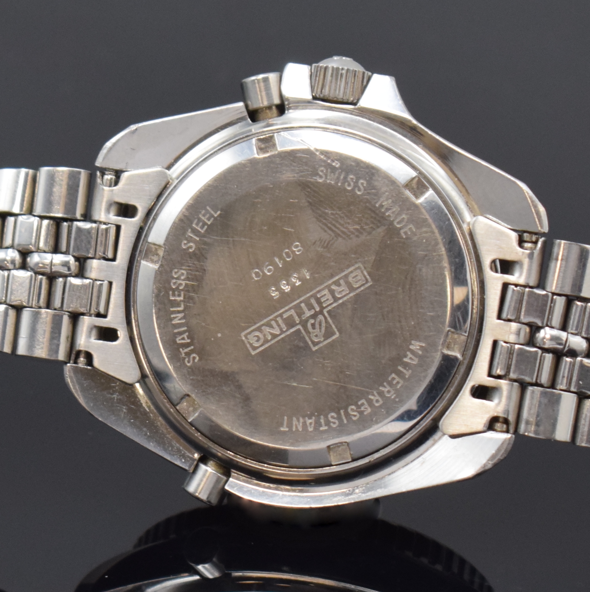 Detail d: BREITLING Navitimer Quartz 2100 Pluton Multifunktionsuhr in Stahl Referenz 80190, Schweiz um 1980, verschr. Geh. inkl. orig. Stahlband m. Faltschl., ...