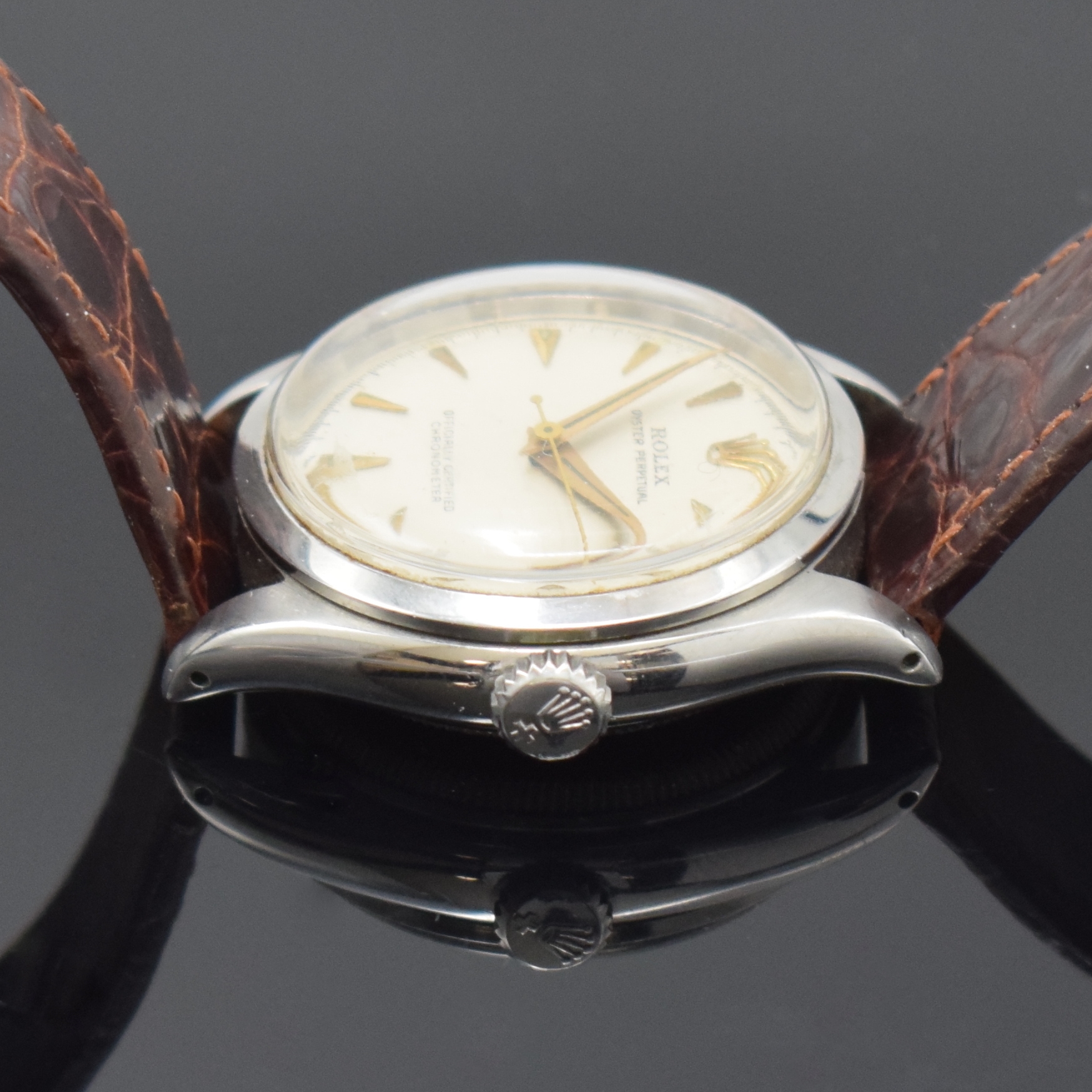 Detail e: ROLEX Oyster Perpetual Referenz 6284 Armbanduhr in Stahl, Schweiz um 1953, Automatik, verschr. Oystergeh., verschr. orig. Krone, silb. Zifferbl. ...