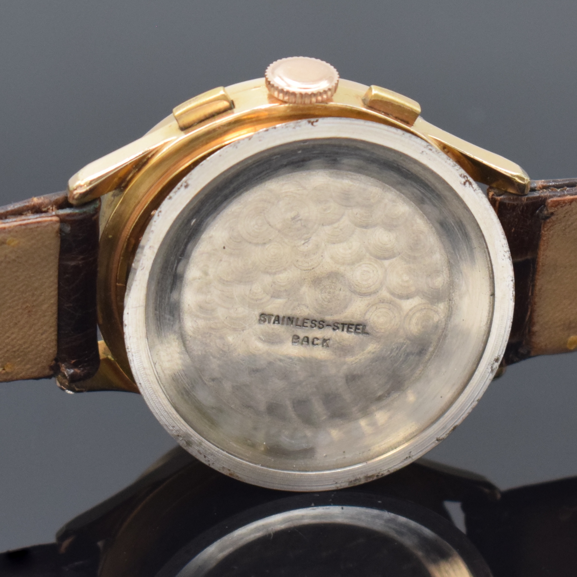 Detail e: Schaltradchronograph mit Kaliber Venus 150, Schweiz um 1960, Handaufzug, verg. Geh., Stahlboden u. Glasrand aufgedr., silb. Zifferbl. bez. Finite ...