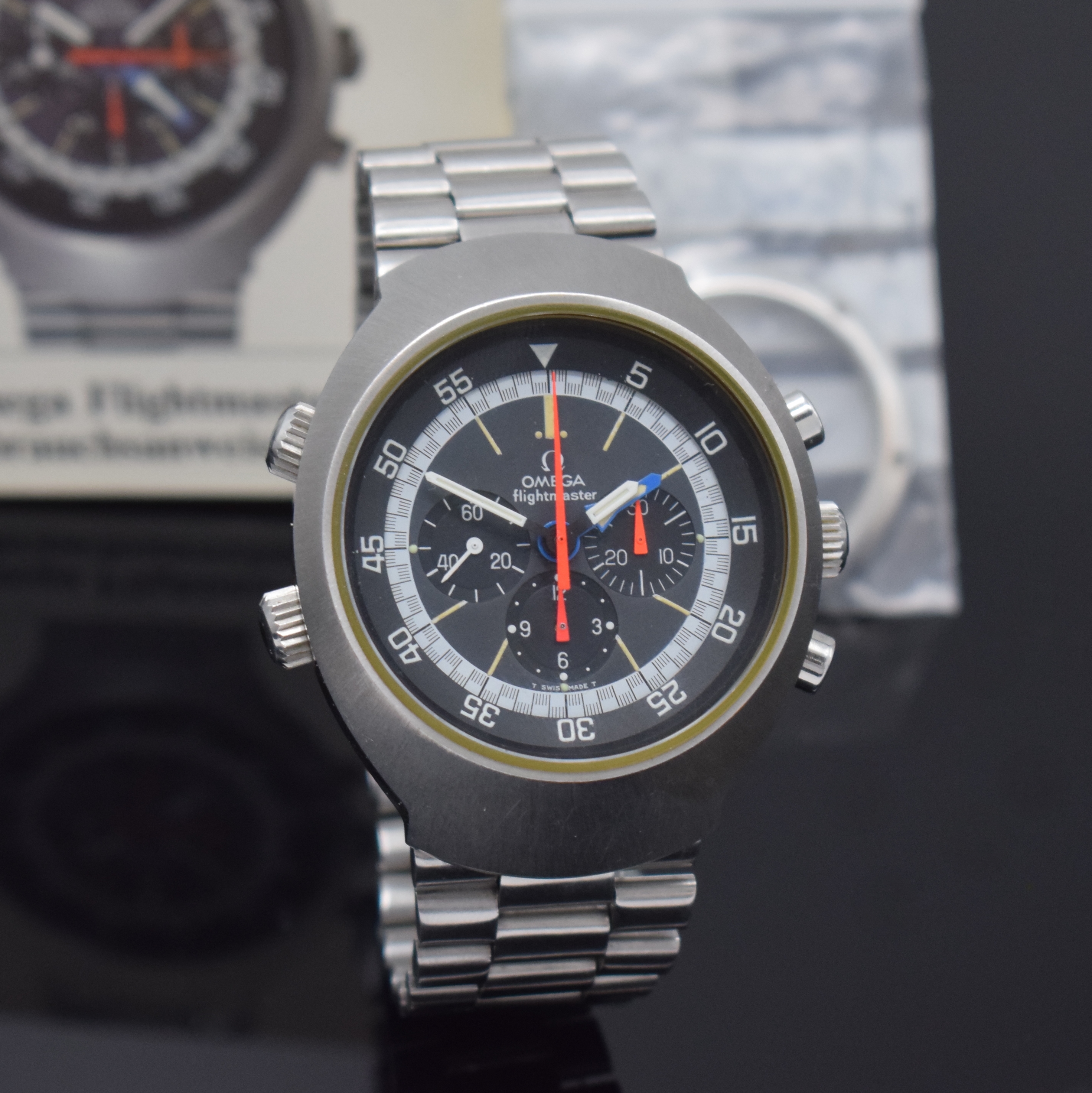 Detail b: OMEGA Flightmaster Armbandchronograph Referenz 145.036, Schweiz um 1973, Handaufzug, massiv. Edelstahlgeh. inkl. neutr. Gliederband m. Faltschl., ...