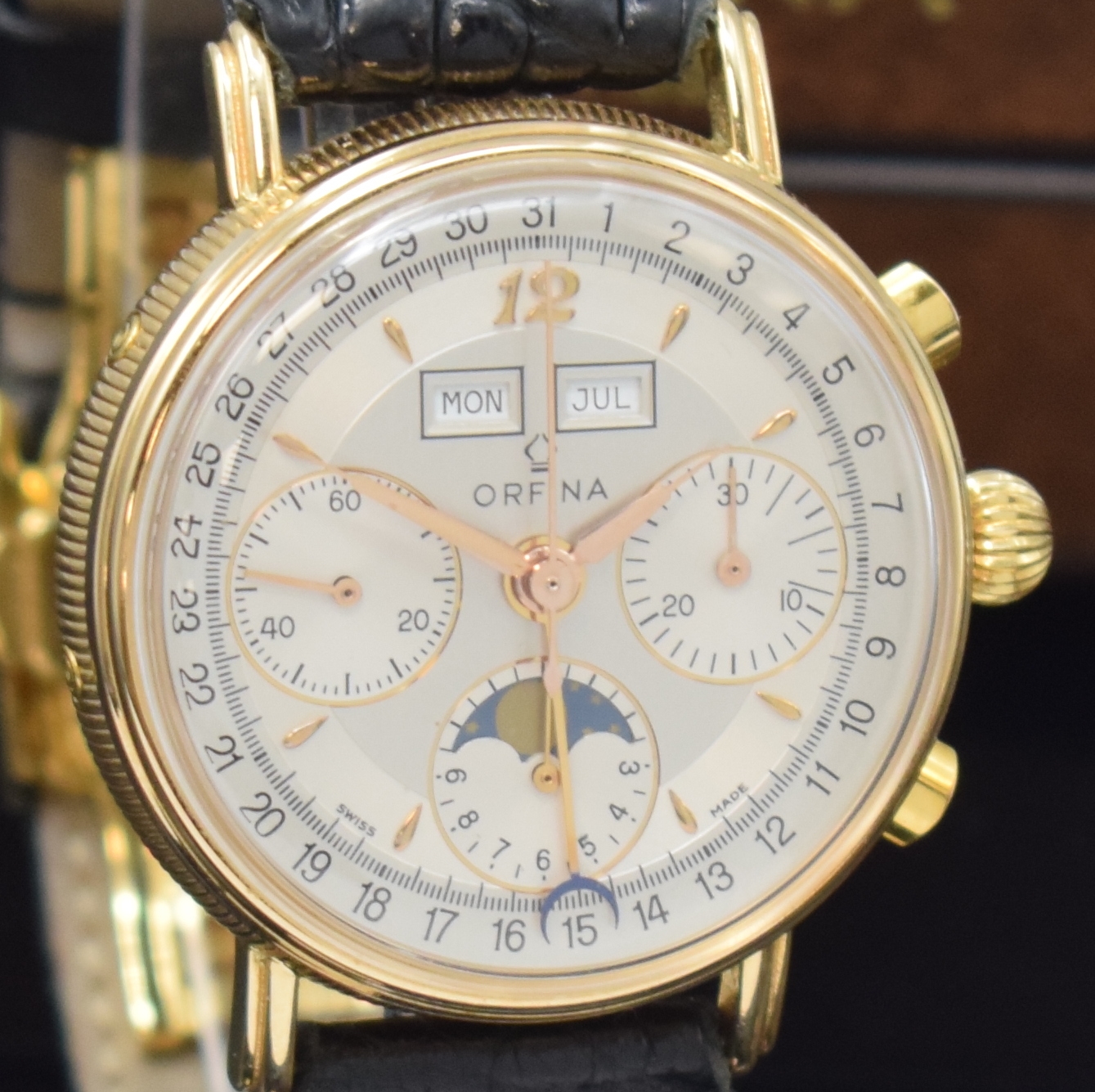 Detail c: ORFINA Herrenarmbanduhr mit Schaltradchronograph und Kalender in RG 750/000 Kaliber Valjoux 886, Schweiz um 1990, Handaufzug, beids. vergl. 3-tlg. ...