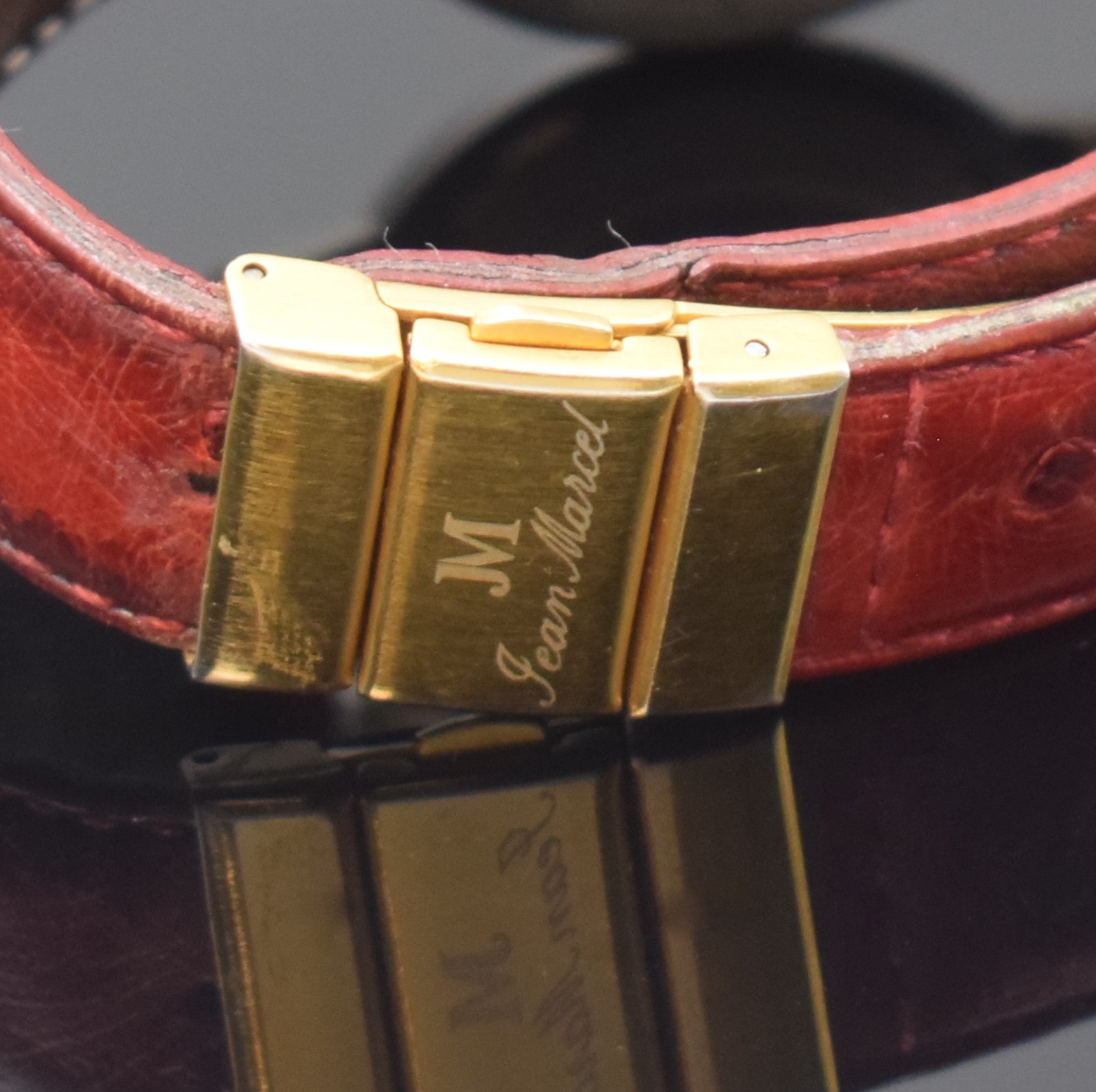 Detail b: JEAN MARCEL Herrenarmbanduhr mit wandernder springender Stunde, Schweiz um 1995, Automatik, beids. vergl. Geh. in Stahl, Boden 4-fach verschr., Krone ...