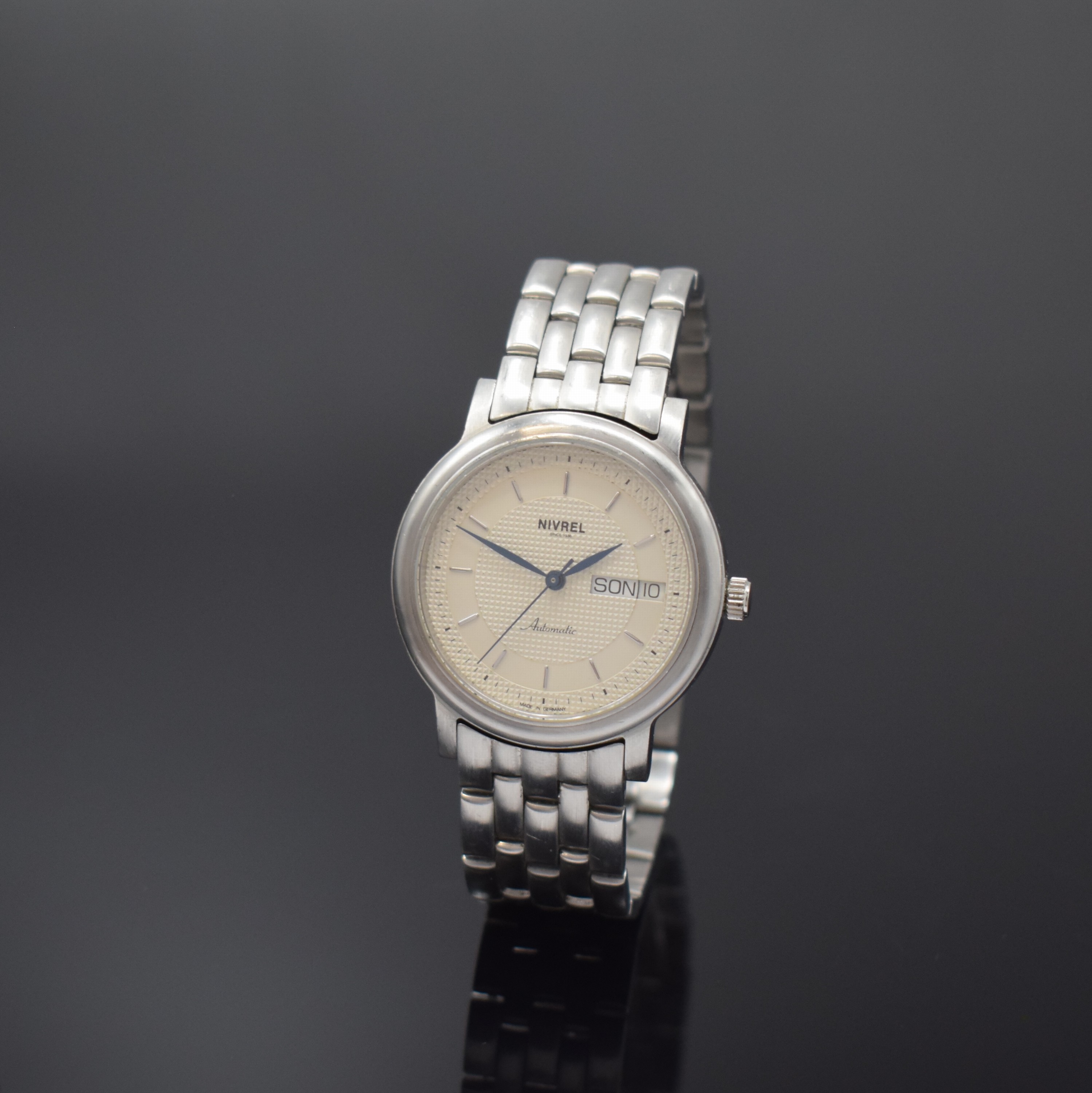 NIVREL Herrenarmbanduhr in Stahl, Schweiz/Deutschland um 2000, Automatik, beids. vergl. Geh., Boden 6-fach verschr., orig. Gliederband m. dopp. ...