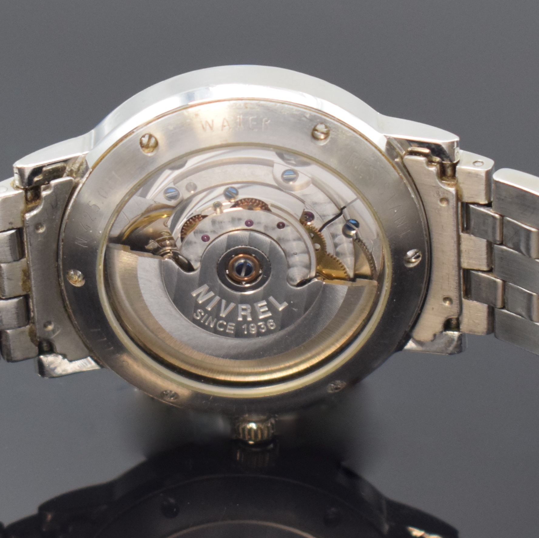 Detail e: NIVREL Herrenarmbanduhr in Stahl, Schweiz/Deutschland um 2000, Automatik, beids. vergl. Geh., Boden 6-fach verschr., orig. Gliederband m. dopp. ...