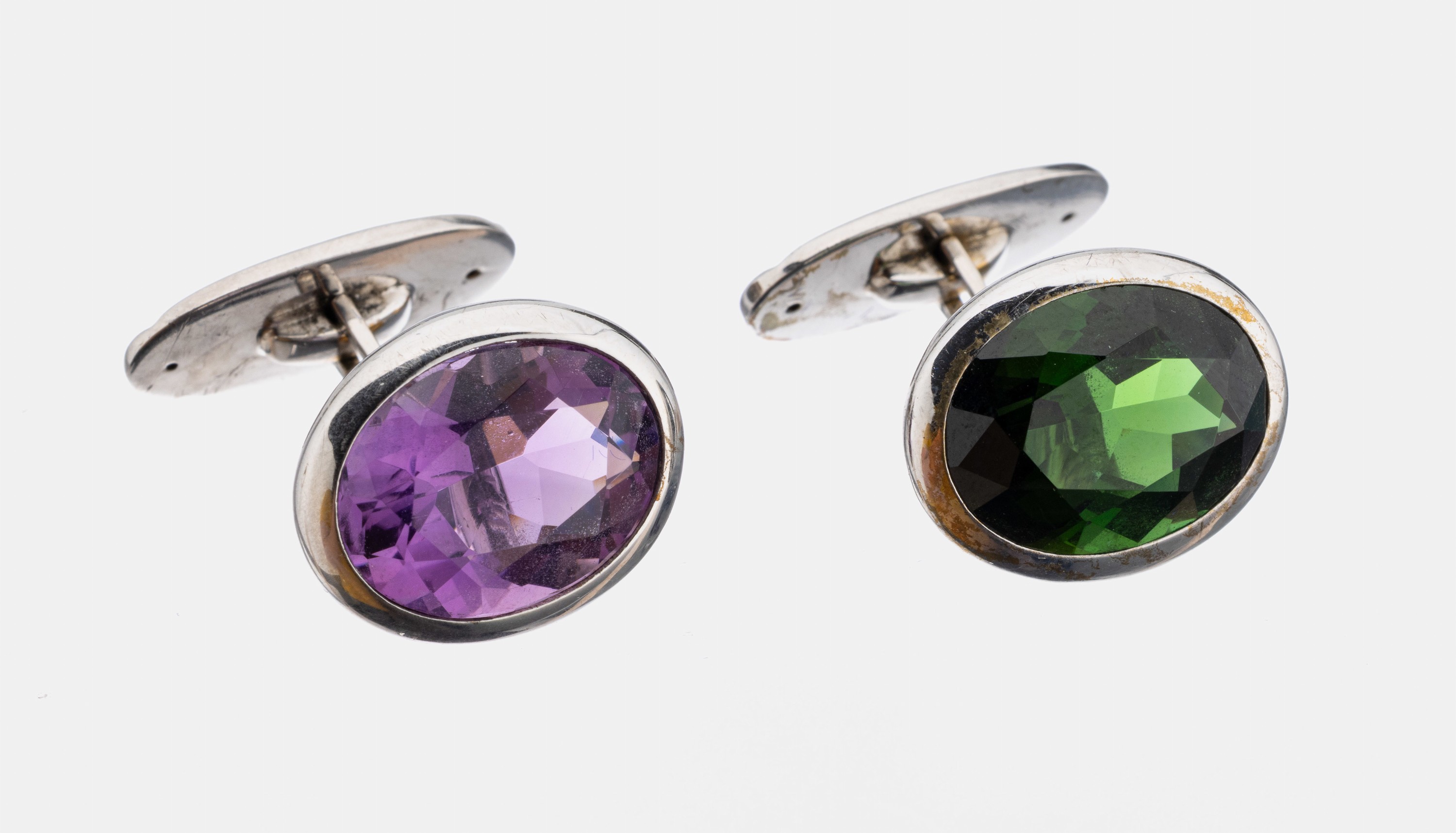 Paar 8 kt Gold Farbstein-Manschettenknöpfe, WG 333/000, ovalfacett. Turmalin und ovalfacett. Amethyst zus. ca. 8.0 ct, gute Farbe, schlichtes ...