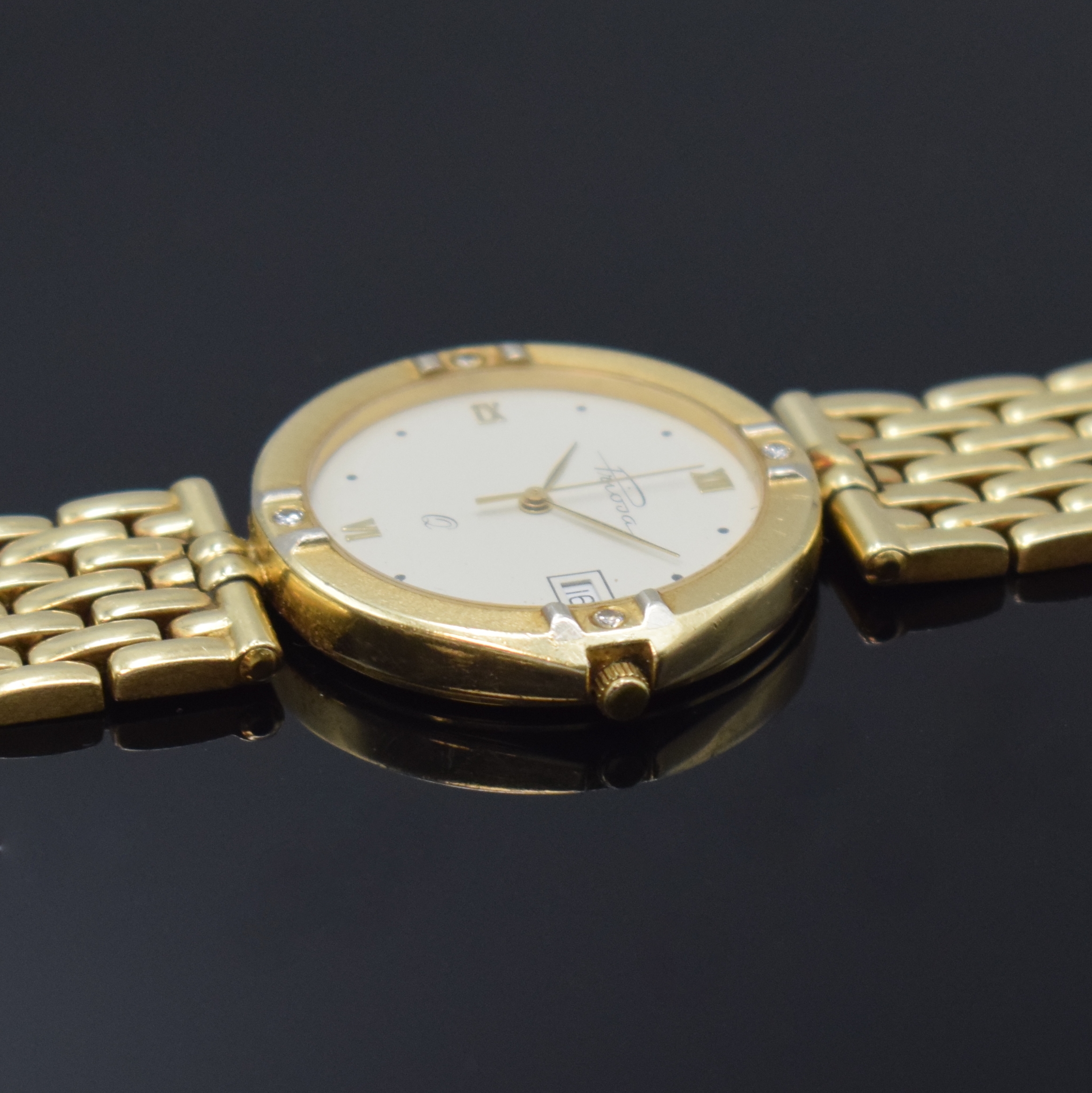 Detail c: PRIOSA Armbanduhr in GG 585/000 mit Diamanten, Schweiz um 1975, quarz, Goldband, Boden gedr., Lünette m. 4 Diamanten bes., cremefarb. Zifferbl. m. ...