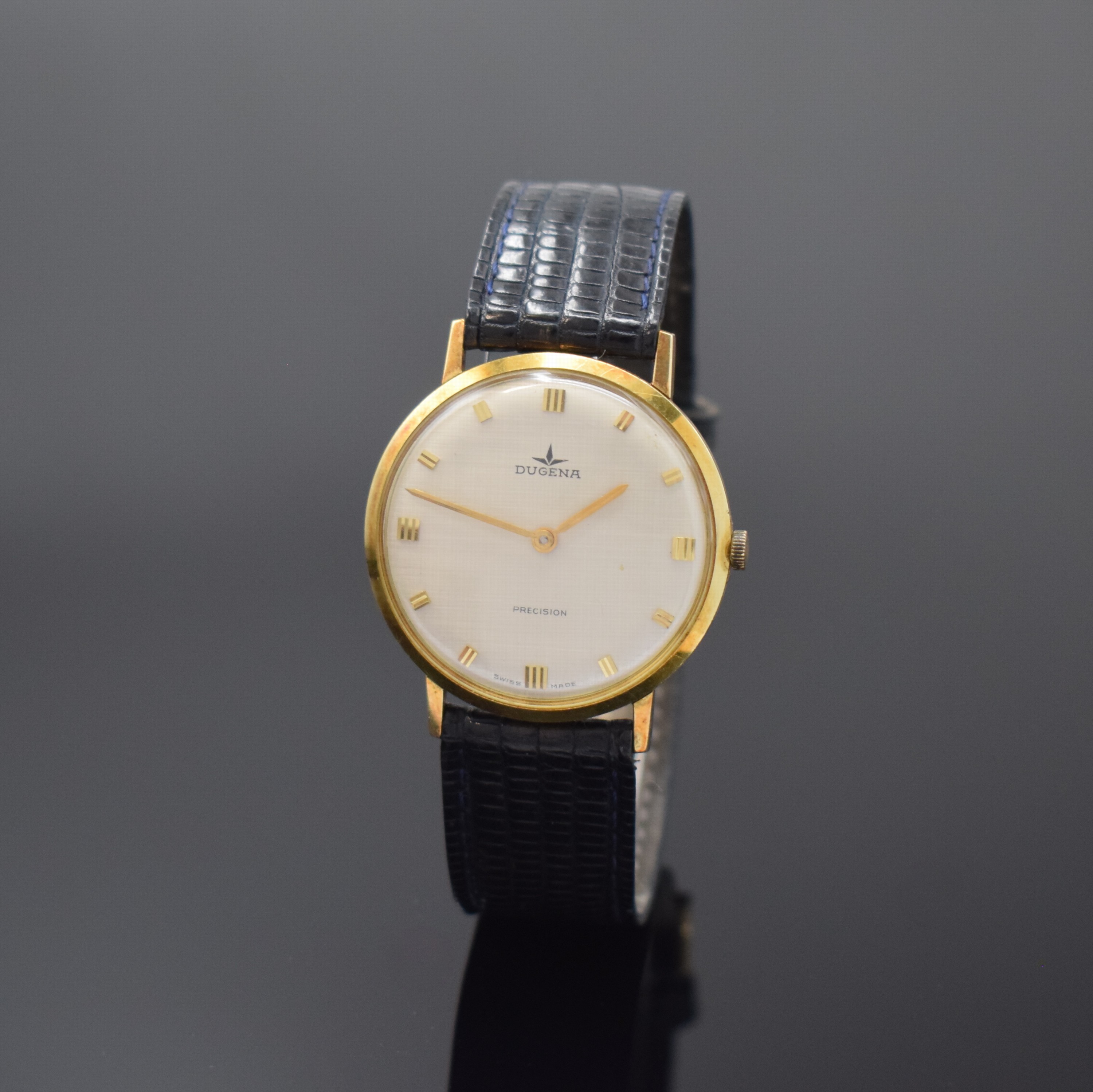 DUGENA Precision Armbanduhr in GG 585/000, Schweiz um 1970, Handaufzug, Glasrand aufgedr., silb. Zifferbl. m. gold. Std.-Ind., gold. Zeiger, sign ...