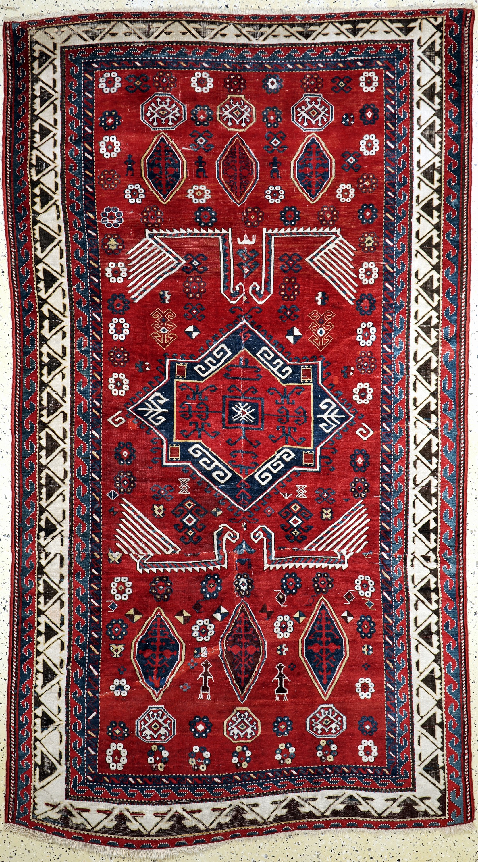 Antiker Kazak, Kaukasus, 19.Jhd, Wolle auf Wolle, ca. 285 x 160 cm, EHZ: 4, (mehrfach zusammengesetzt & restauriert).