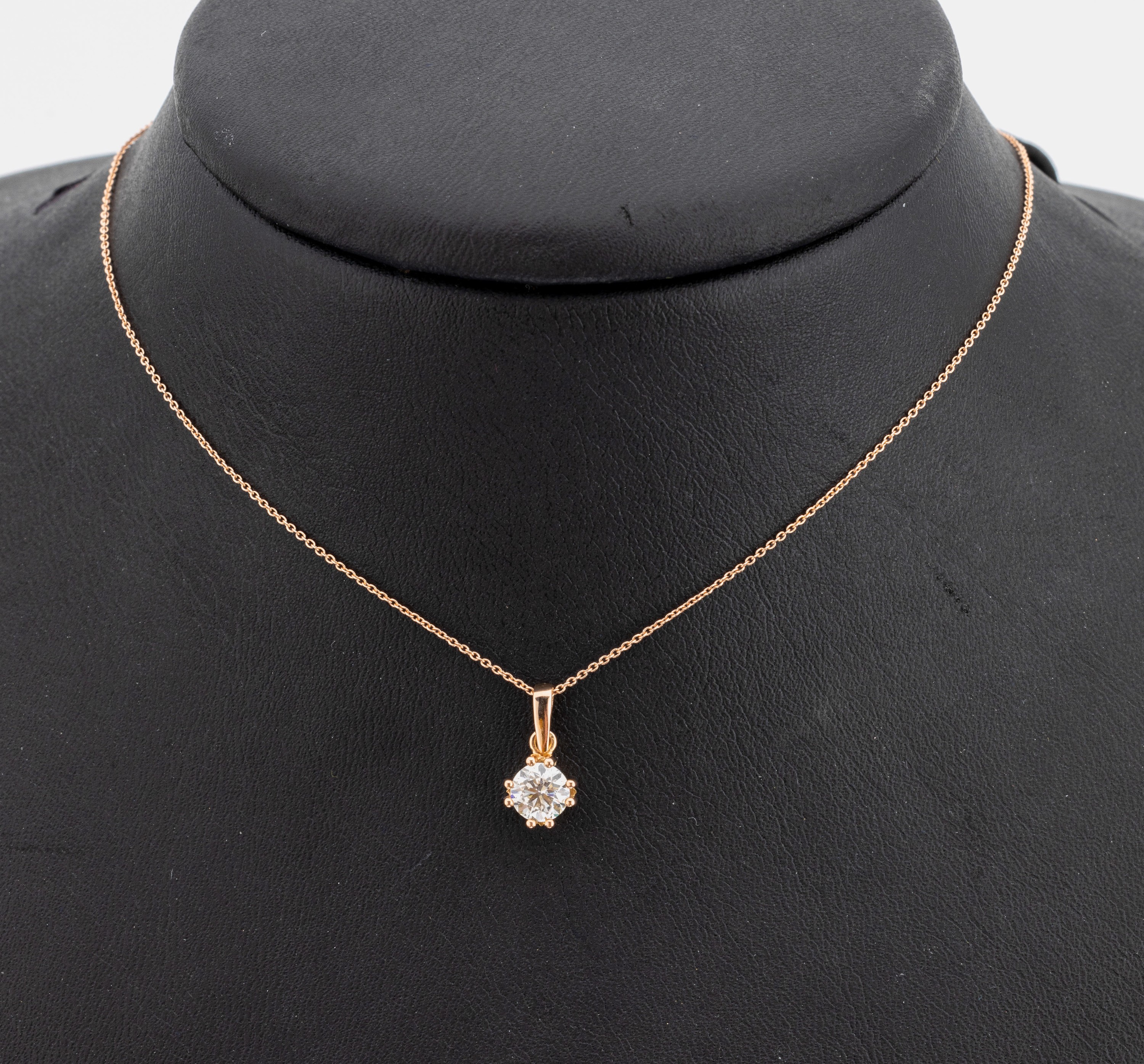 14 kt Gold Brillant-Anhänger, RoseG 585/000mit Kette, L ca. 40 cm, Federringschließe, 1 Brillant ca. 0.62 ct feines Weiß (G)/si 1, lt. AIG ...