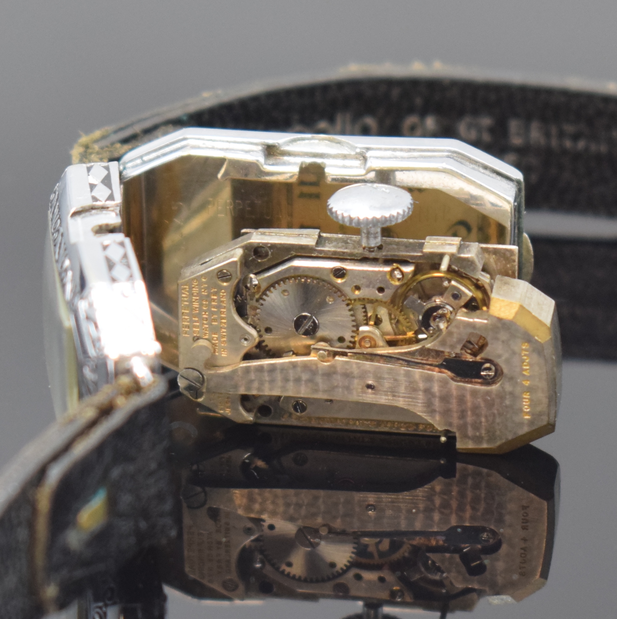 Detail e: PERPETUAL SELF WINDING WATCH Co frühe Automatikarmbanduhr, Schweiz/Deutschland um 1930, Pendel-Automatik, rechteck. 14K Goldfilled Geh., Front u. ...