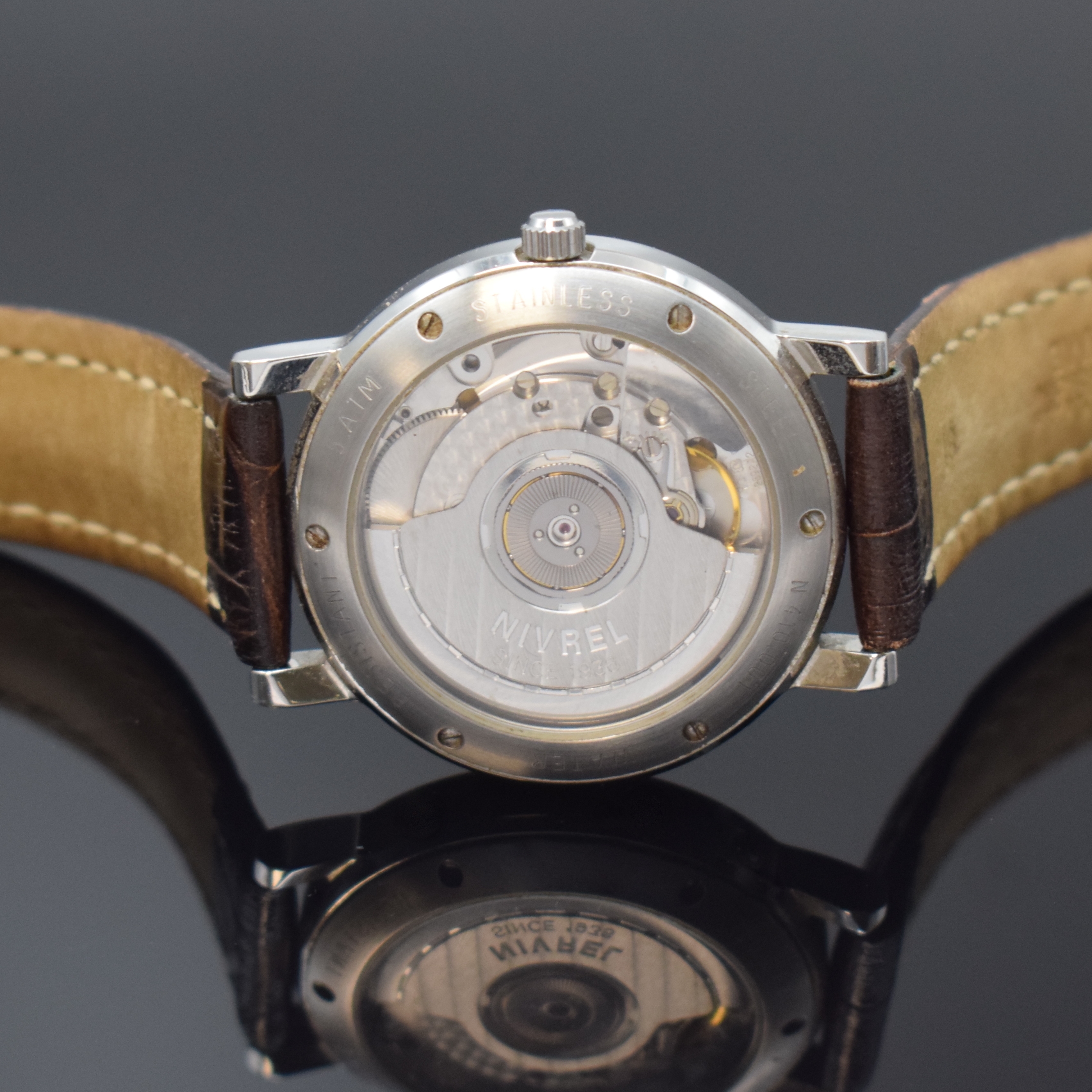 Detail c: NIVREL Armbanduhr mit Gangreserveanzeige und 2. Zeitzone, Schweiz um 1995, Automatik, beids. vergl. Geh., Boden u. Krone verschr., silb. ...