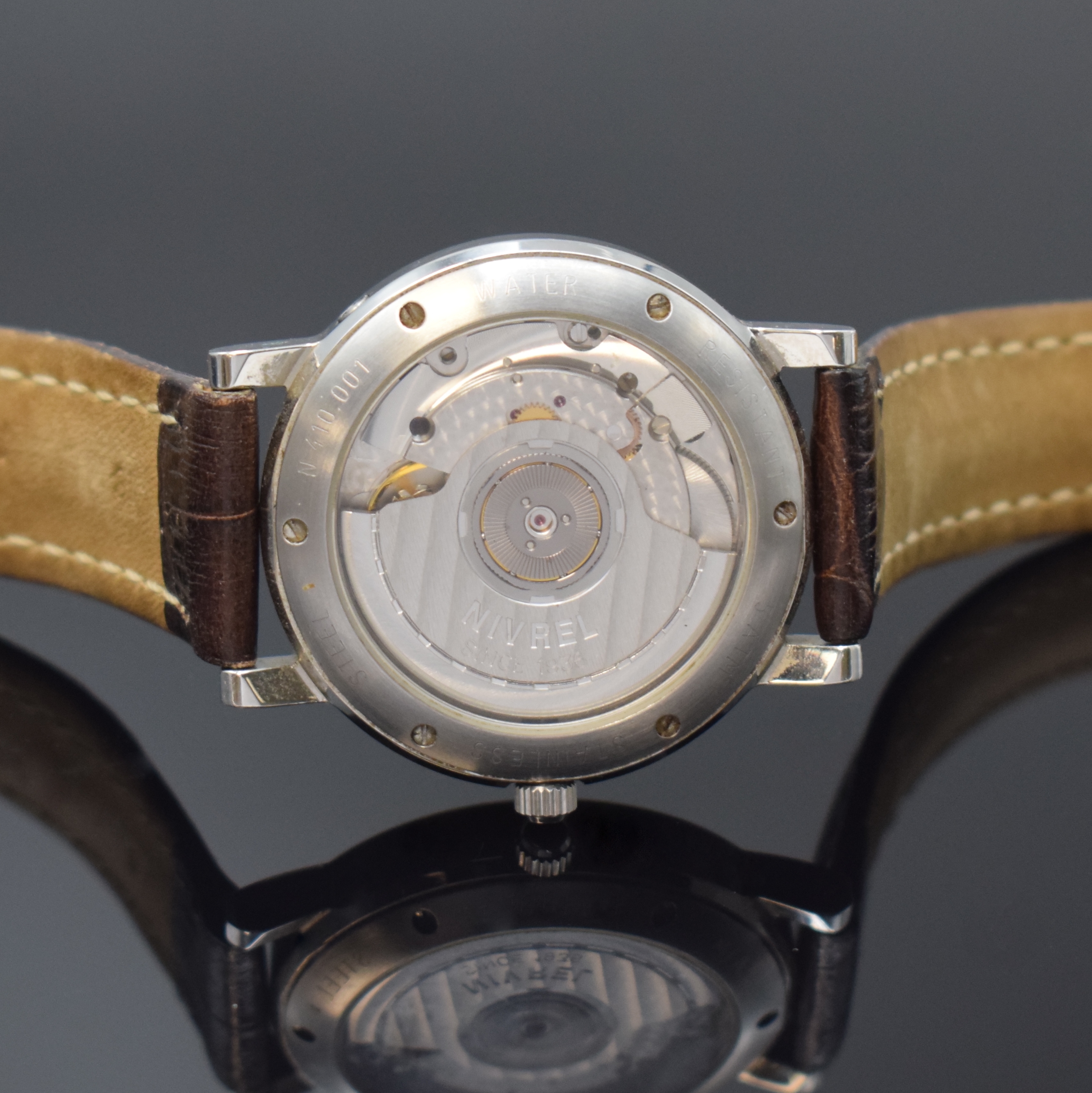 Detail d: NIVREL Armbanduhr mit Gangreserveanzeige und 2. Zeitzone, Schweiz um 1995, Automatik, beids. vergl. Geh., Boden u. Krone verschr., silb. ...