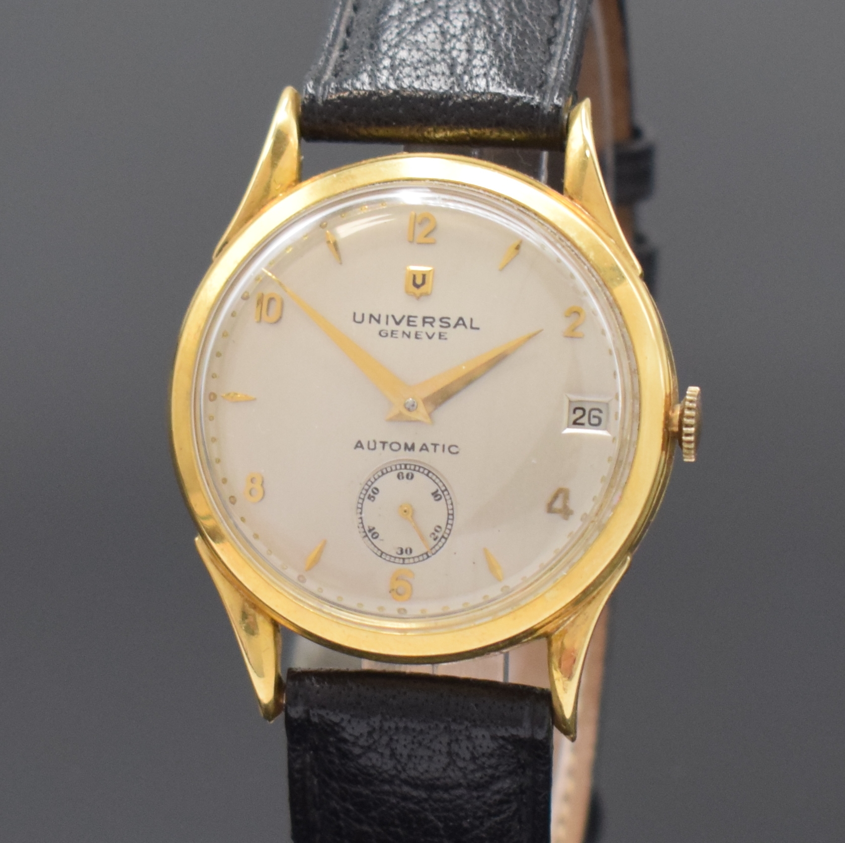 Detail a: UNIVERSAL GENEVE Herrenarmbanduhr in GG 750/000 mit Hammerautomatik Referenz 100101, Schweiz um 1953, Boden und Glasrand aufgedr., Zifferblatt rest., ...