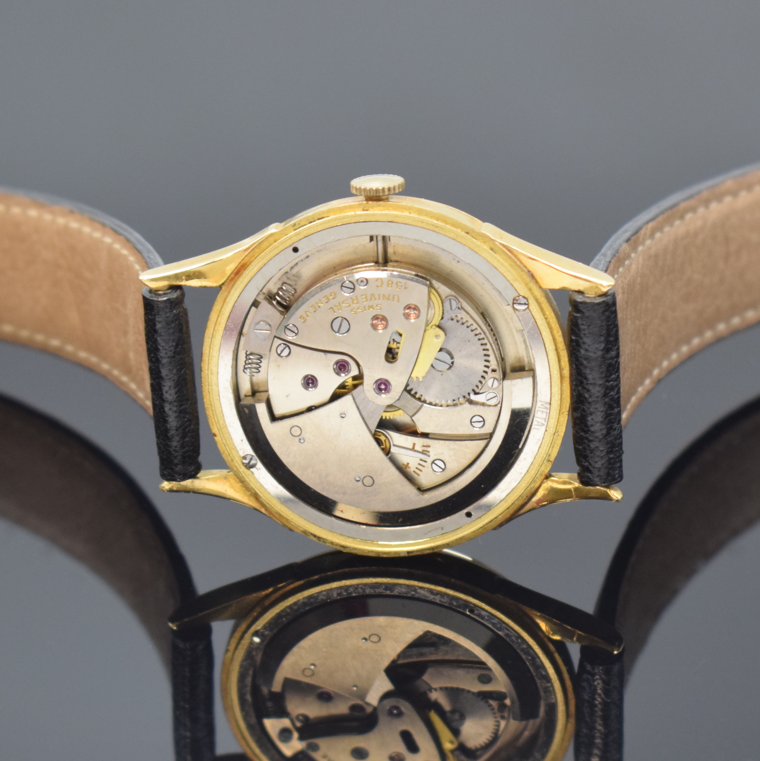 Detail d: UNIVERSAL GENEVE Herrenarmbanduhr in GG 750/000 mit Hammerautomatik Referenz 100101, Schweiz um 1953, Boden und Glasrand aufgedr., Zifferblatt rest., ...
