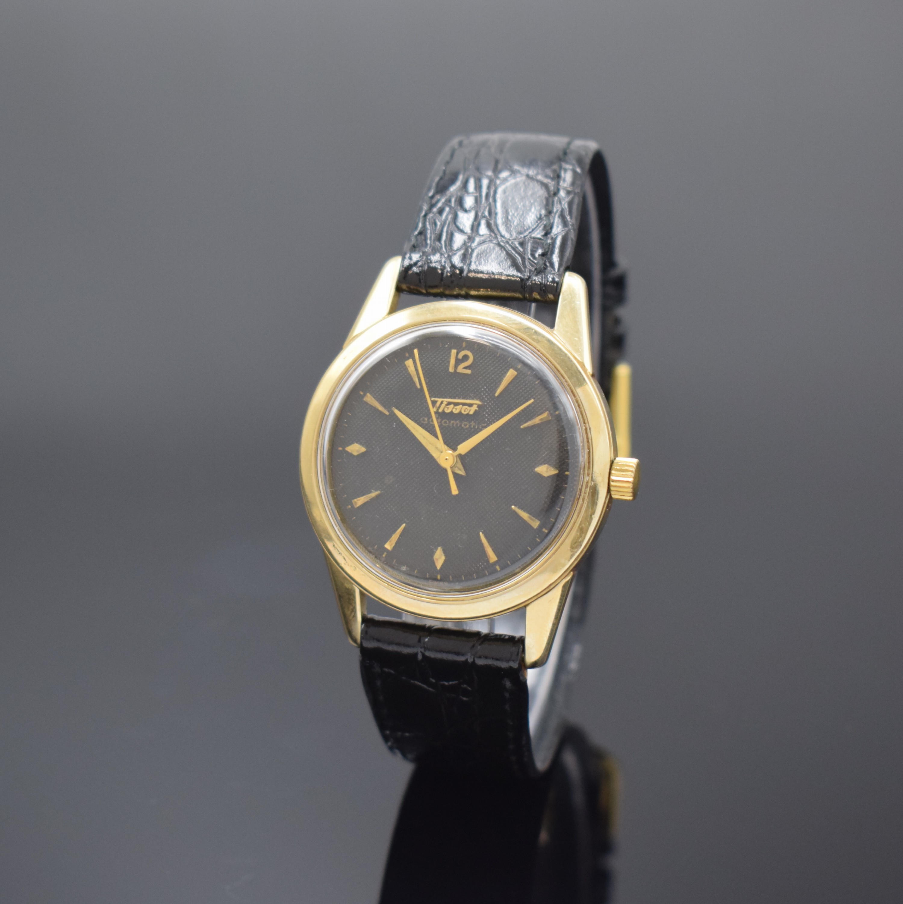 TISSOT Herrenarmbanduhr in GG 585/000, Automatik, Schweiz um 1955, 2-teil. Geh., Boden verschr., schwarzes Zifferbl. m. aufgel. Std.-Zeichen, Anz. v. ...