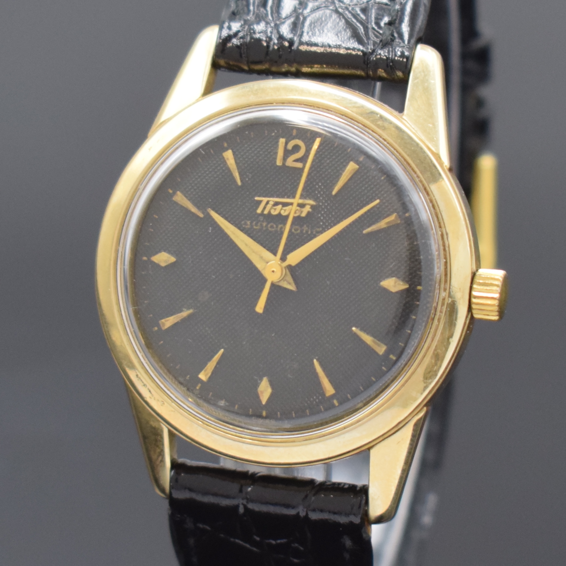 Detail a: TISSOT Herrenarmbanduhr in GG 585/000, Automatik, Schweiz um 1955, 2-teil. Geh., Boden verschr., schwarzes Zifferbl. m. aufgel. Std.-Zeichen, Anz. v. ...