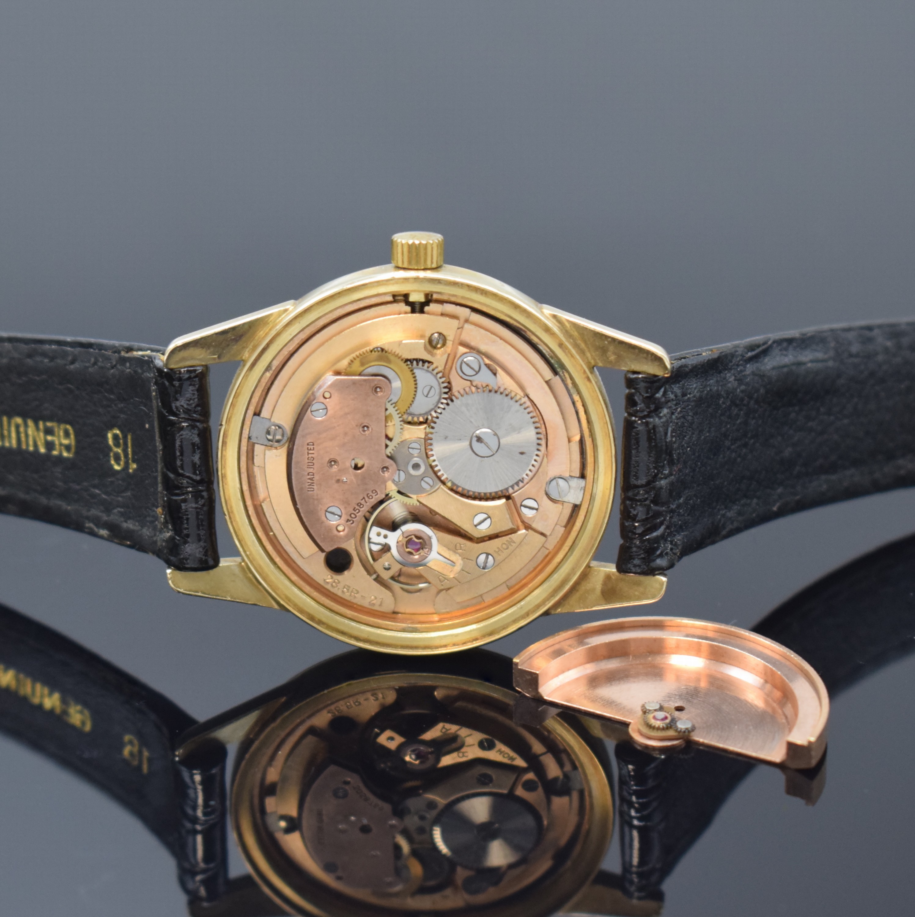 Detail d: TISSOT Herrenarmbanduhr in GG 585/000, Automatik, Schweiz um 1955, 2-teil. Geh., Boden verschr., schwarzes Zifferbl. m. aufgel. Std.-Zeichen, Anz. v. ...