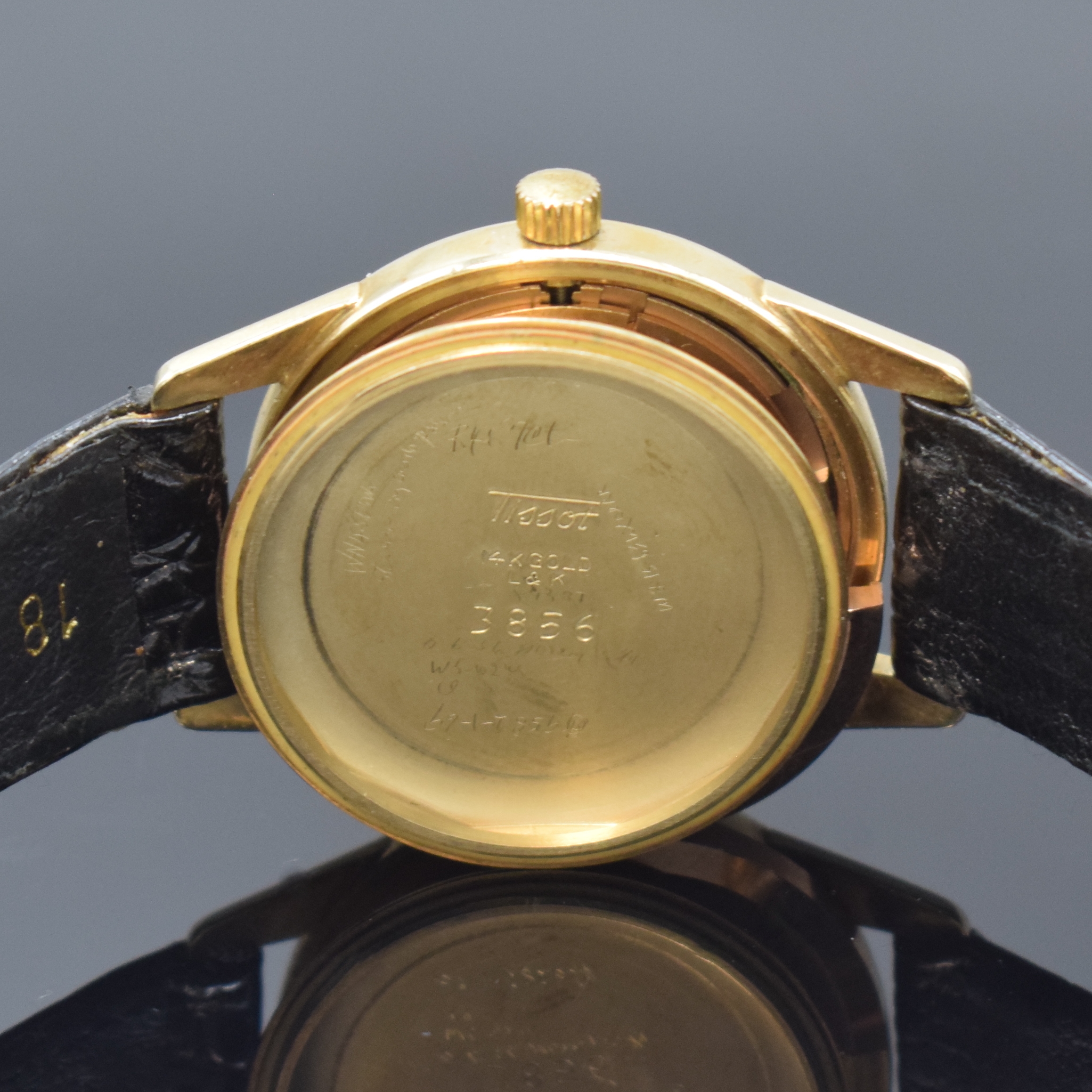 Detail e: TISSOT Herrenarmbanduhr in GG 585/000, Automatik, Schweiz um 1955, 2-teil. Geh., Boden verschr., schwarzes Zifferbl. m. aufgel. Std.-Zeichen, Anz. v. ...