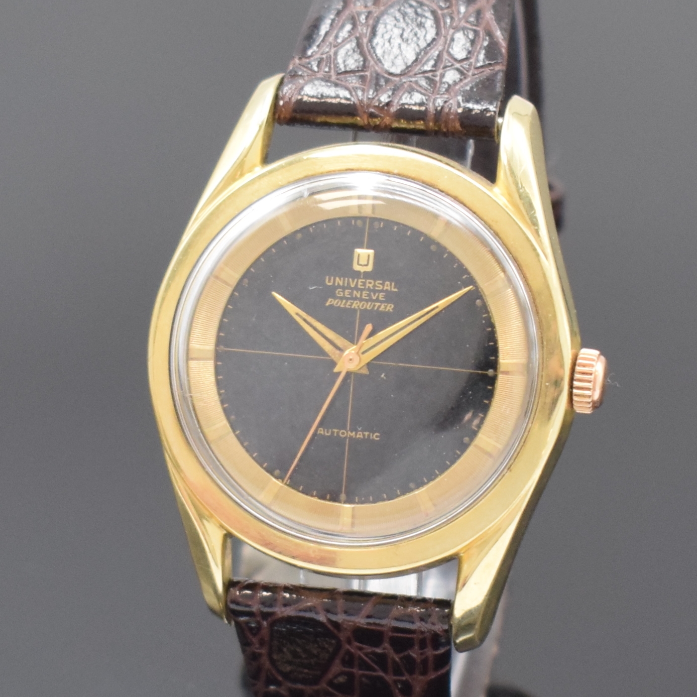 Detail a: UNIVERSAL GENEVE Herrenarmbanduhr Polerouter mit Hammerautomatik, Schweiz um 1950, Edelstahlgeh. mit Goldhaube, schwarzes shiny Dial mit Fadenkreuz ...